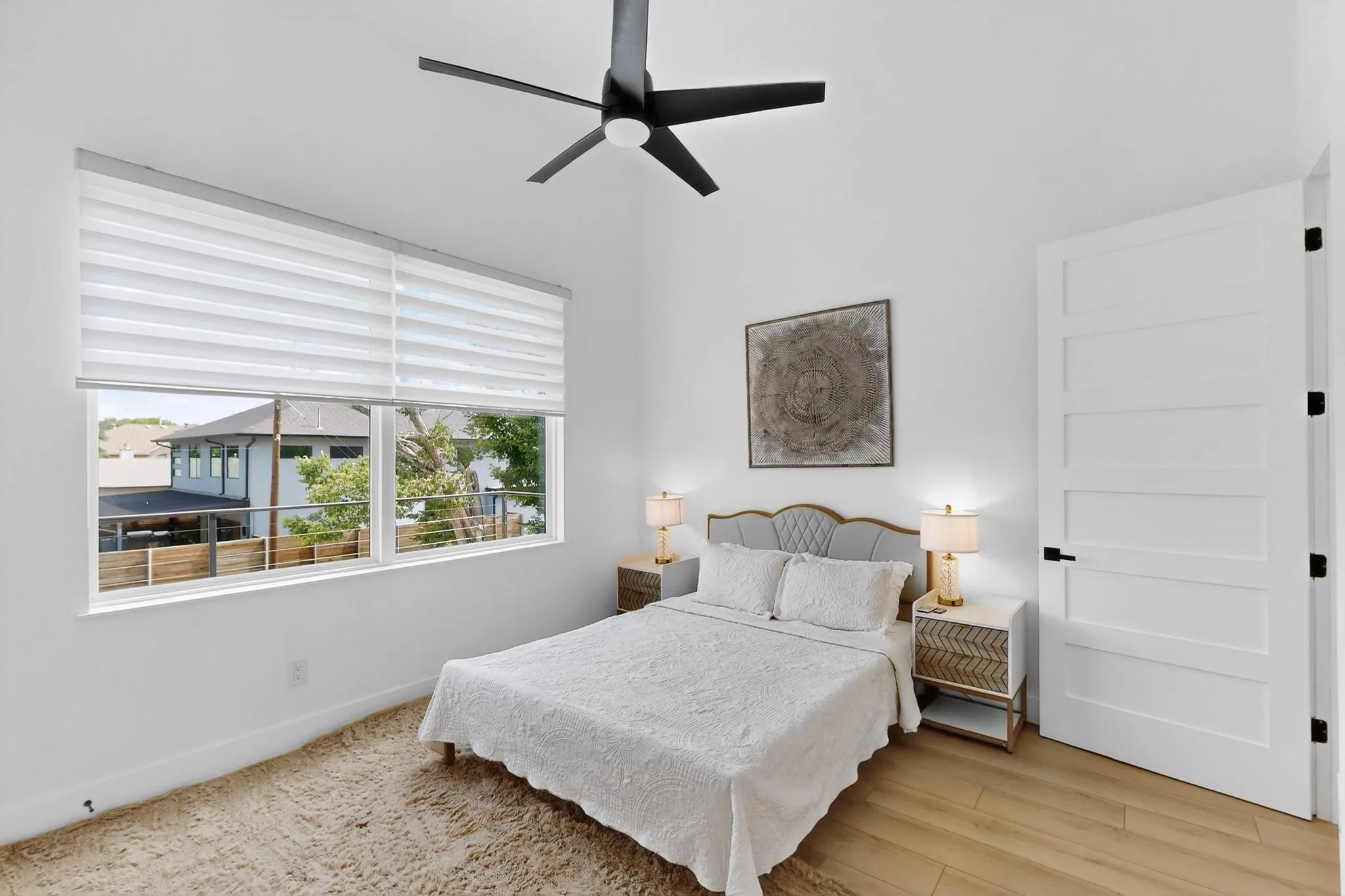 Room featuring wood-finish flooring and a contemporary five-panel door