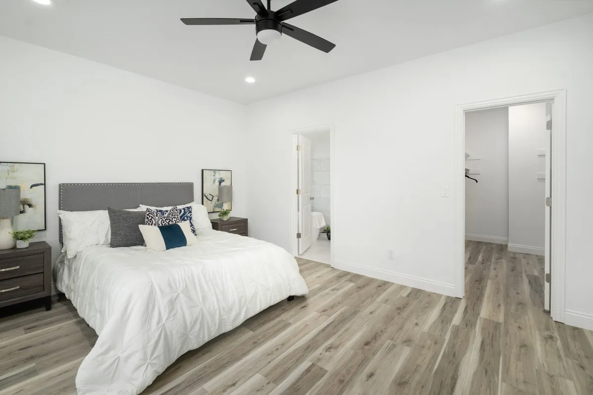 Primary bedroom has a large walk-in closet with built in closet system.
