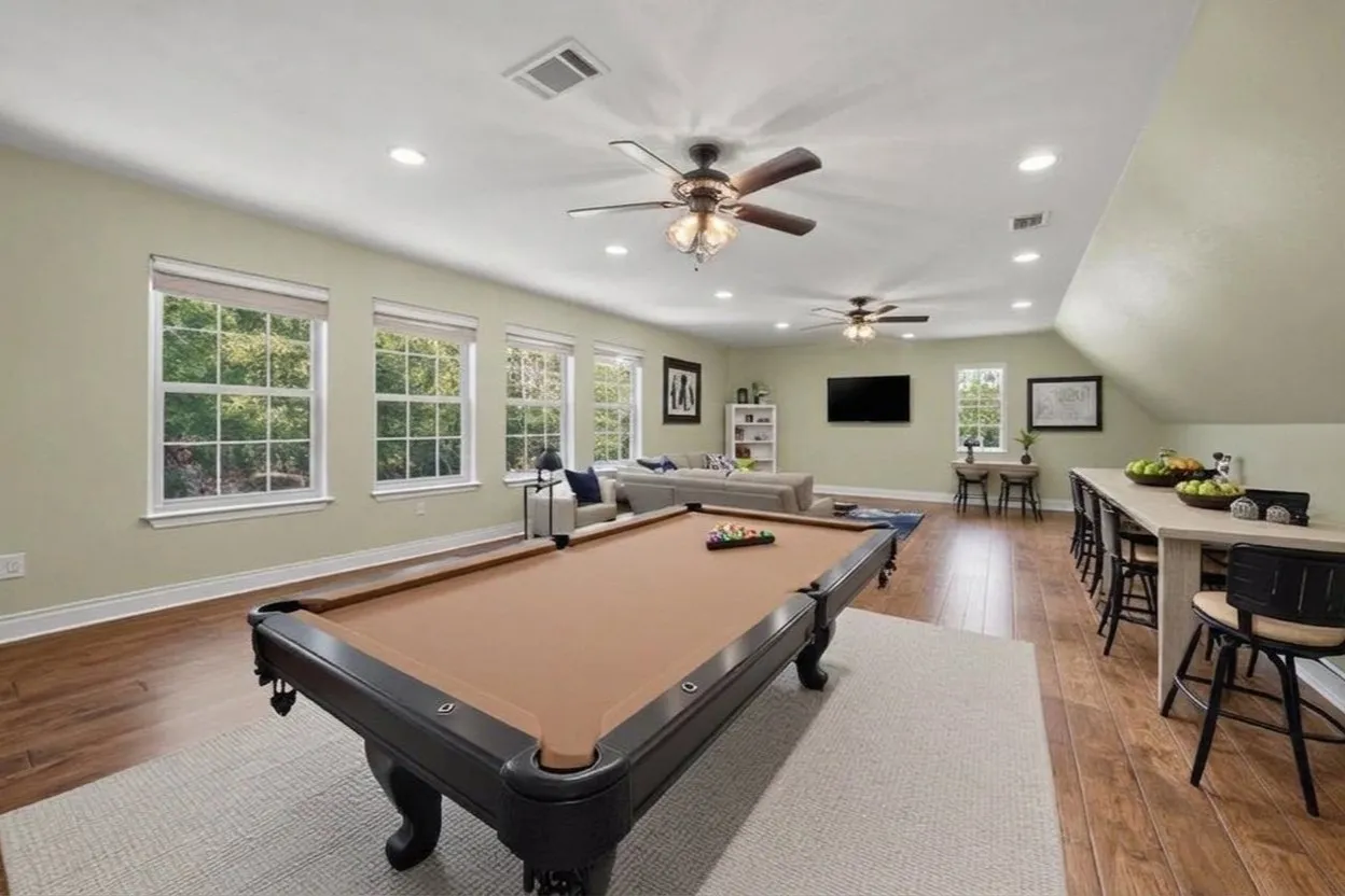 upstairs game room featuring full bath. Could also be separate living quarters
