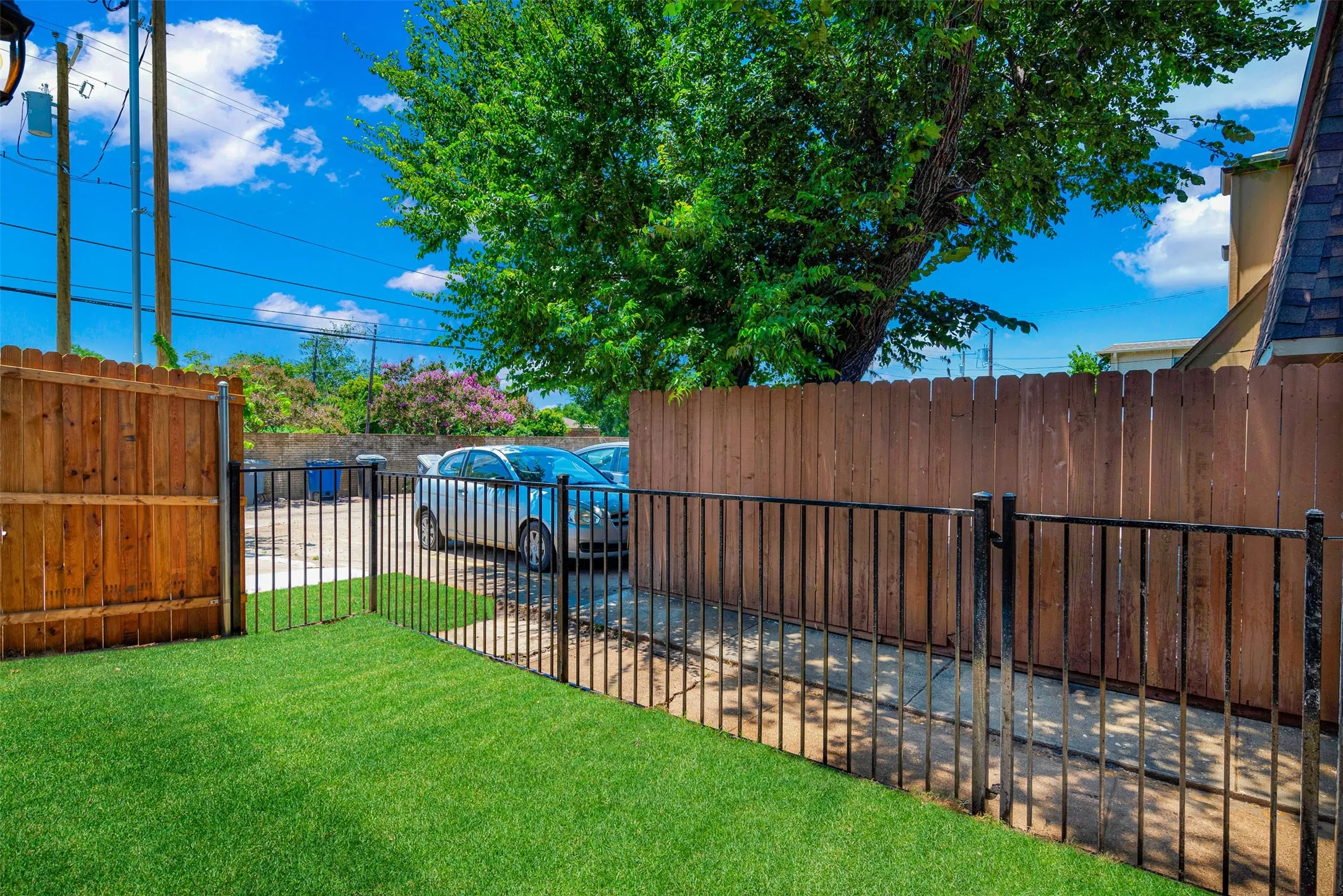   A small, well-maintained grassy area, perfect for casual outdoor enjoyment and perhaps some light activities.