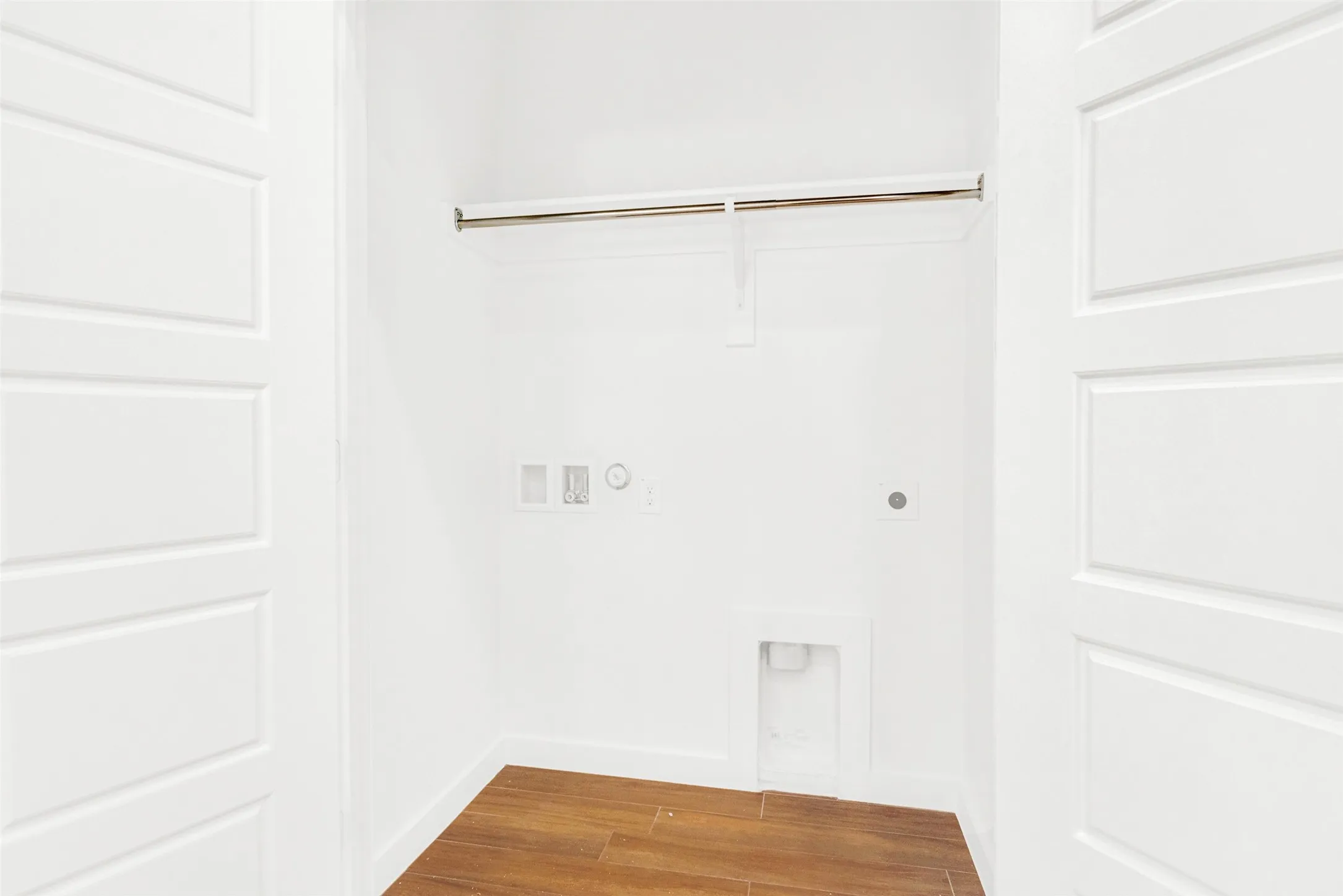 Adjacent to the kitchen area is standard washer and dryer sized laundry room.