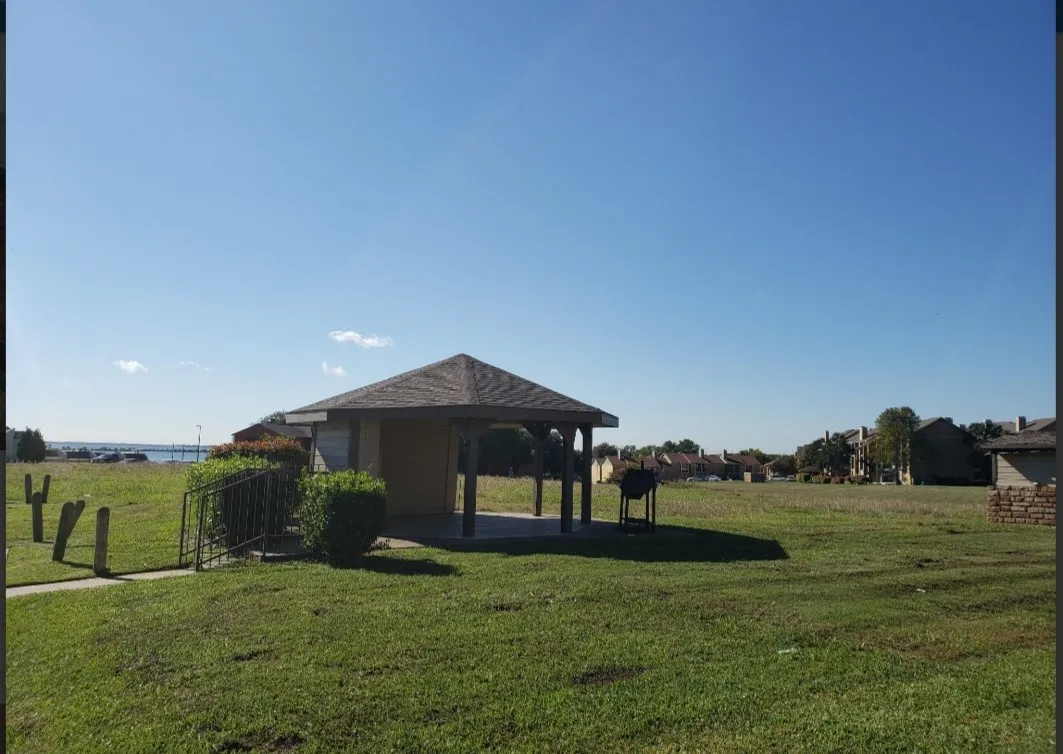View of yard with a gazebo (mail area) looking to the lake