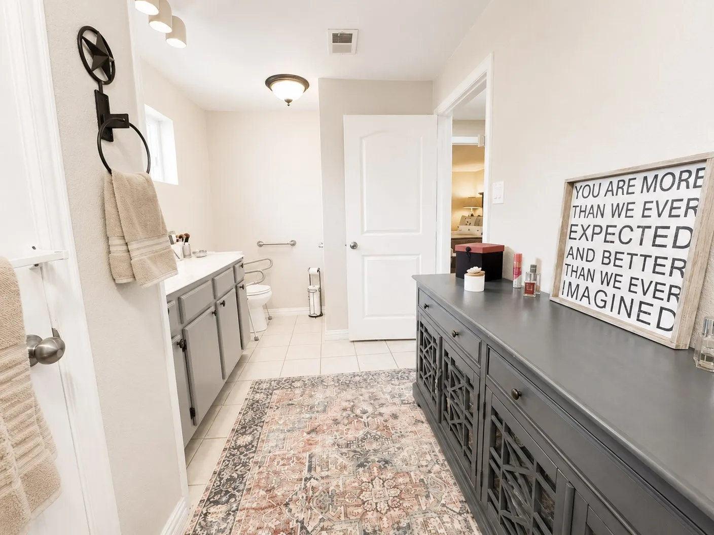 2nd hall Bathroom featuring a vanity with gray cabinetry, white countertop, and integrated sink