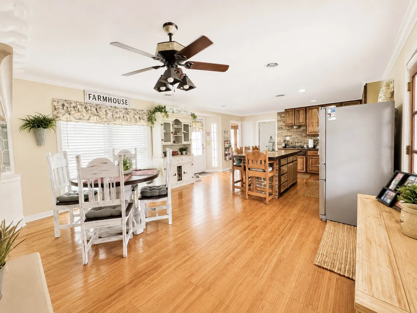 Open-concept living space with wood-finish flooring