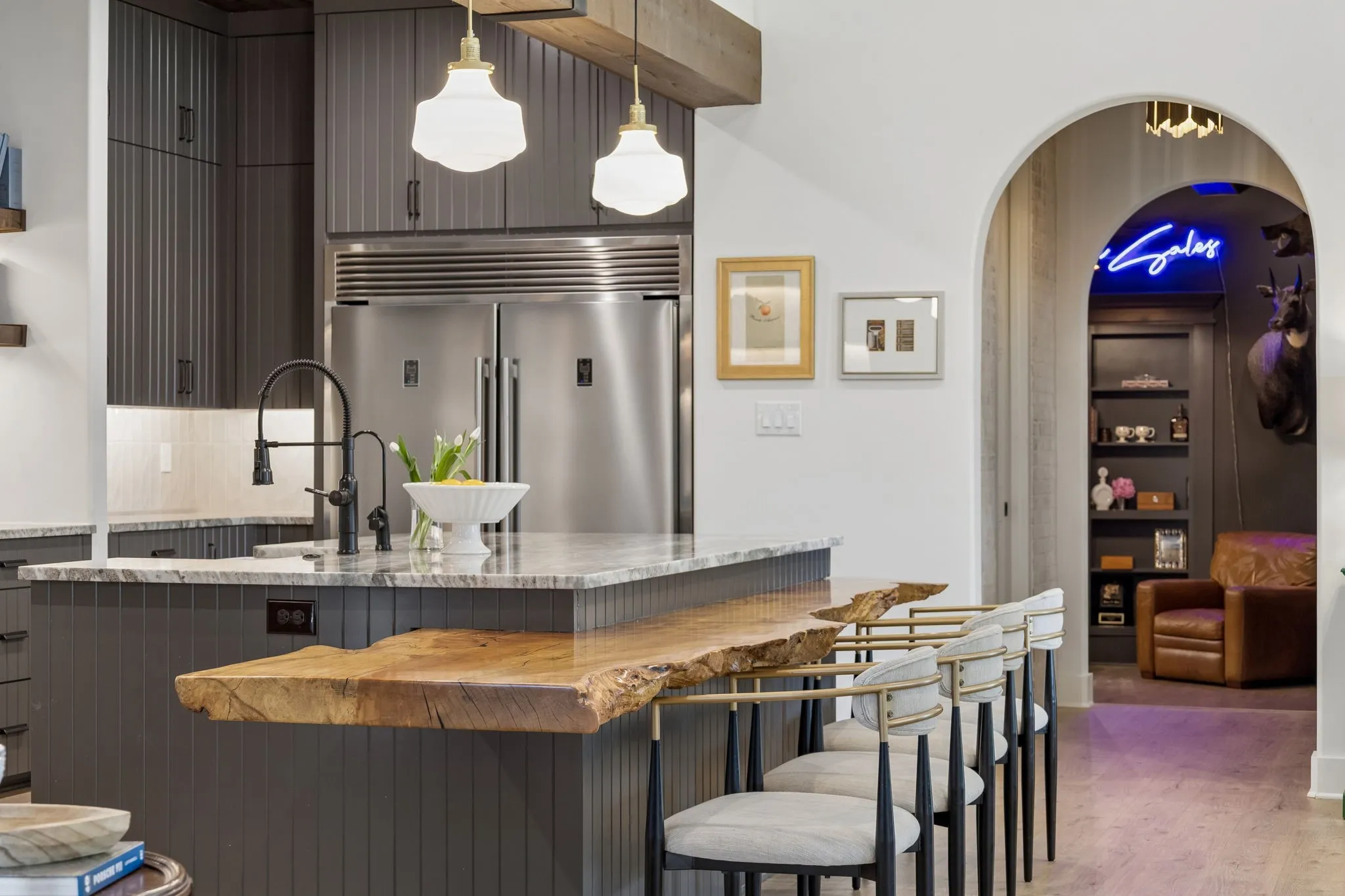 True chef's kitchen with one of a kind island, cedar beams and built-in refrigerator