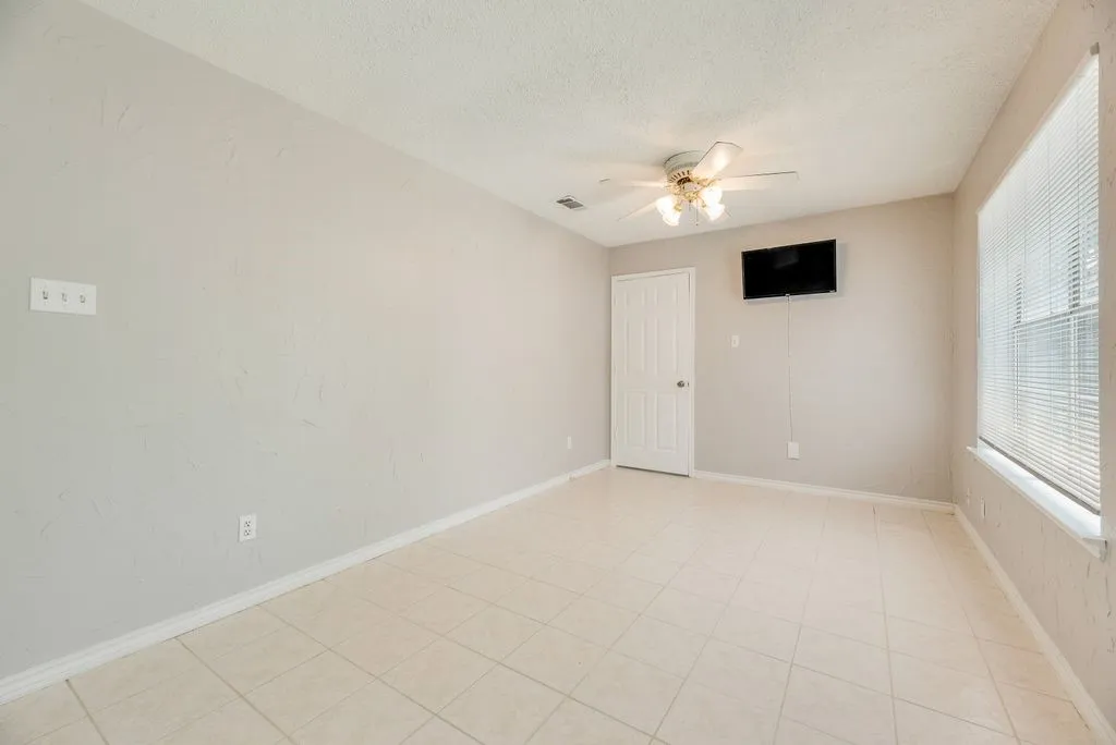 Room featuring tile flooring and neutral wall tones
