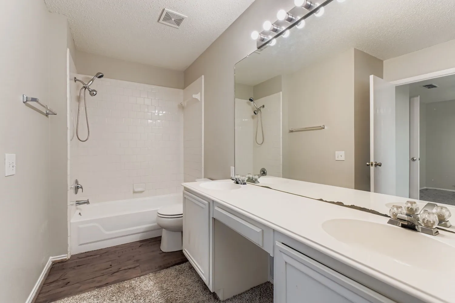 Double vanity with integrated sinks and ample countertop space