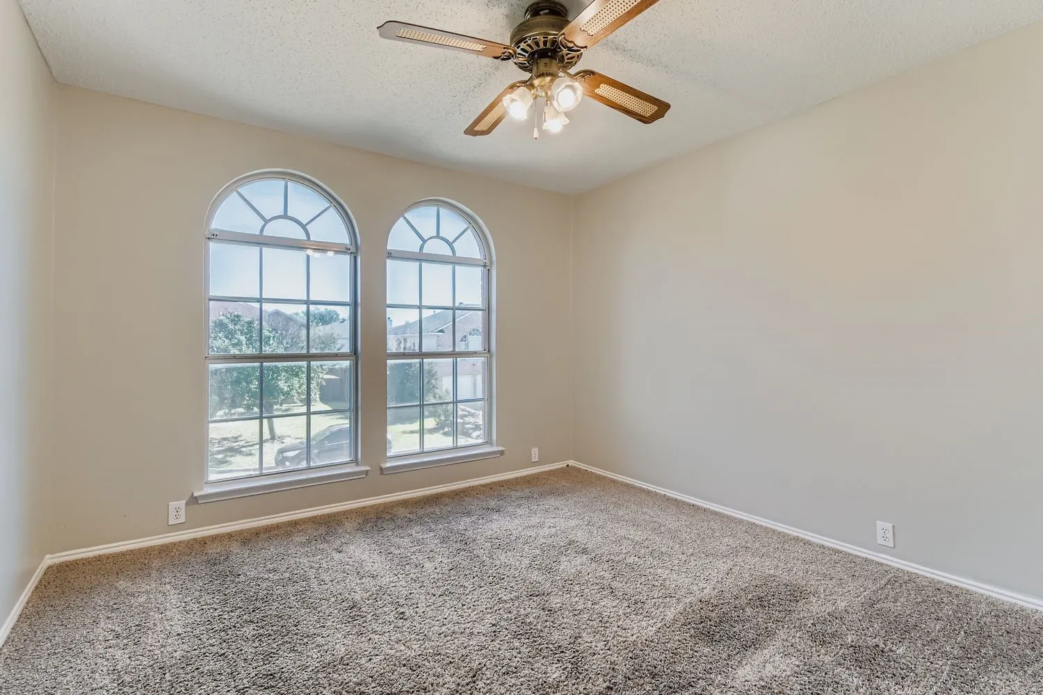 Double arched windows with interior grids and white trim