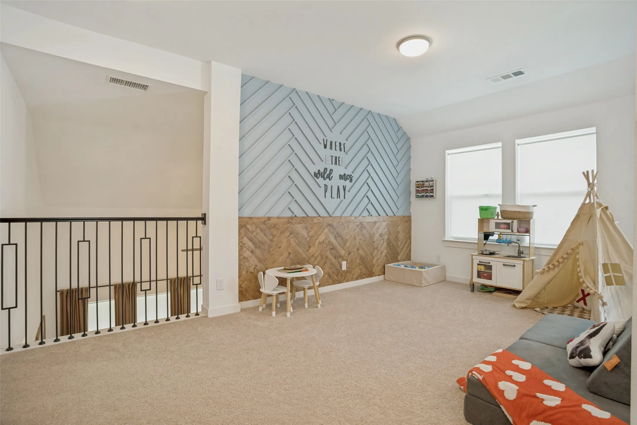 Loft area with custom wall design.