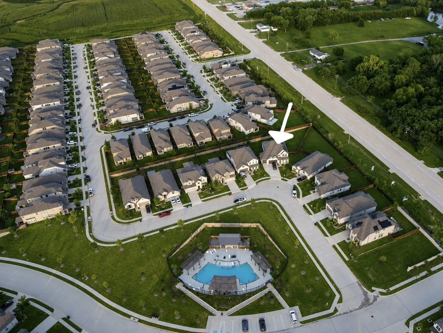 Aerial view of home and proximity to community pool