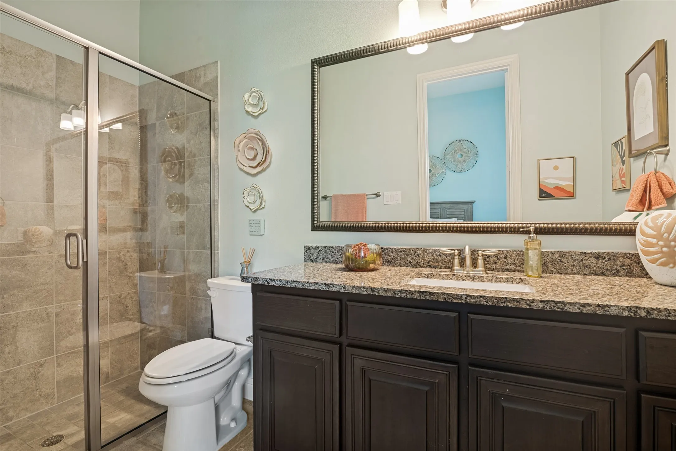 Full bathroom featuring a walk-in shower with tile surround, glass enclosure, and integrated bench
