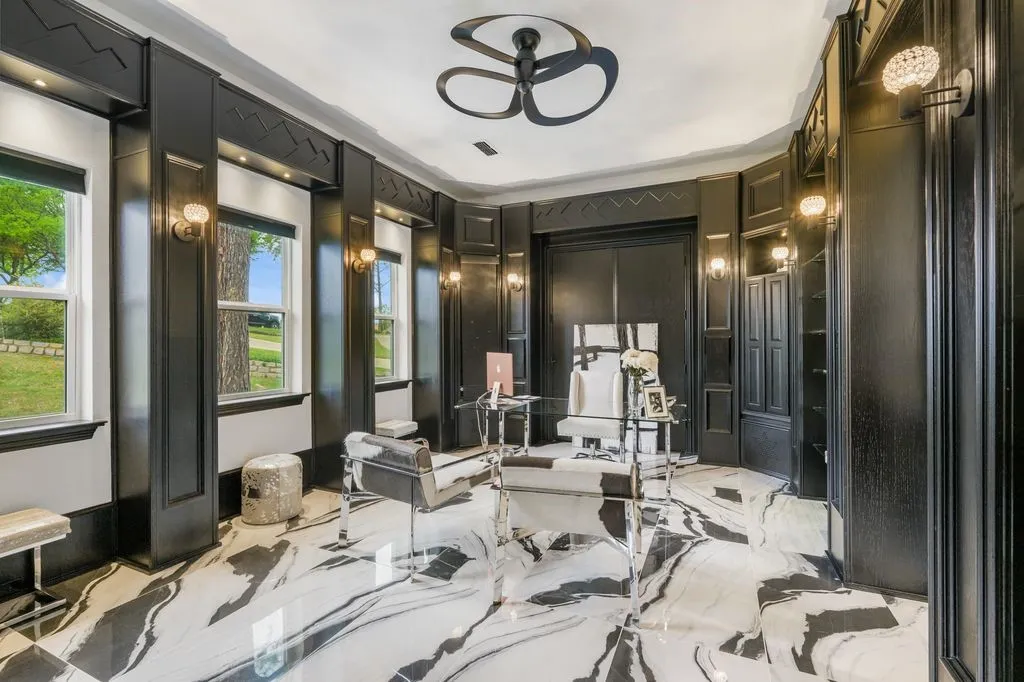 Elegant private office featuring dramatic design details and abundant natural light, with the versatility to serve as an additional bedroom. Includes access to a full bathroom.