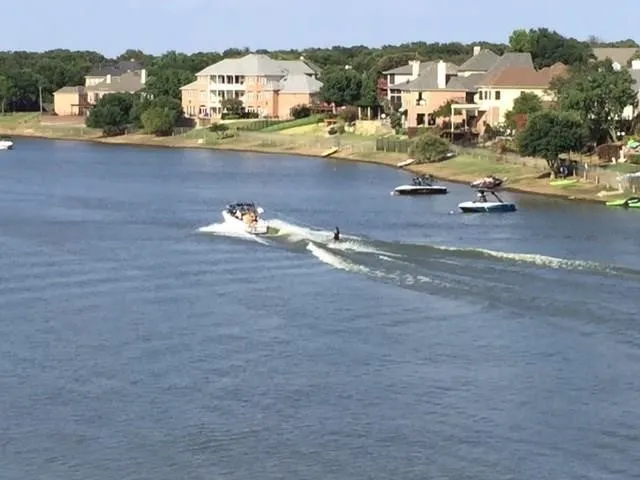 Enjoy effortless lakefront living with direct access to boating, water sports or simply peaceful sailing and serene moments on Lake Lewisville.