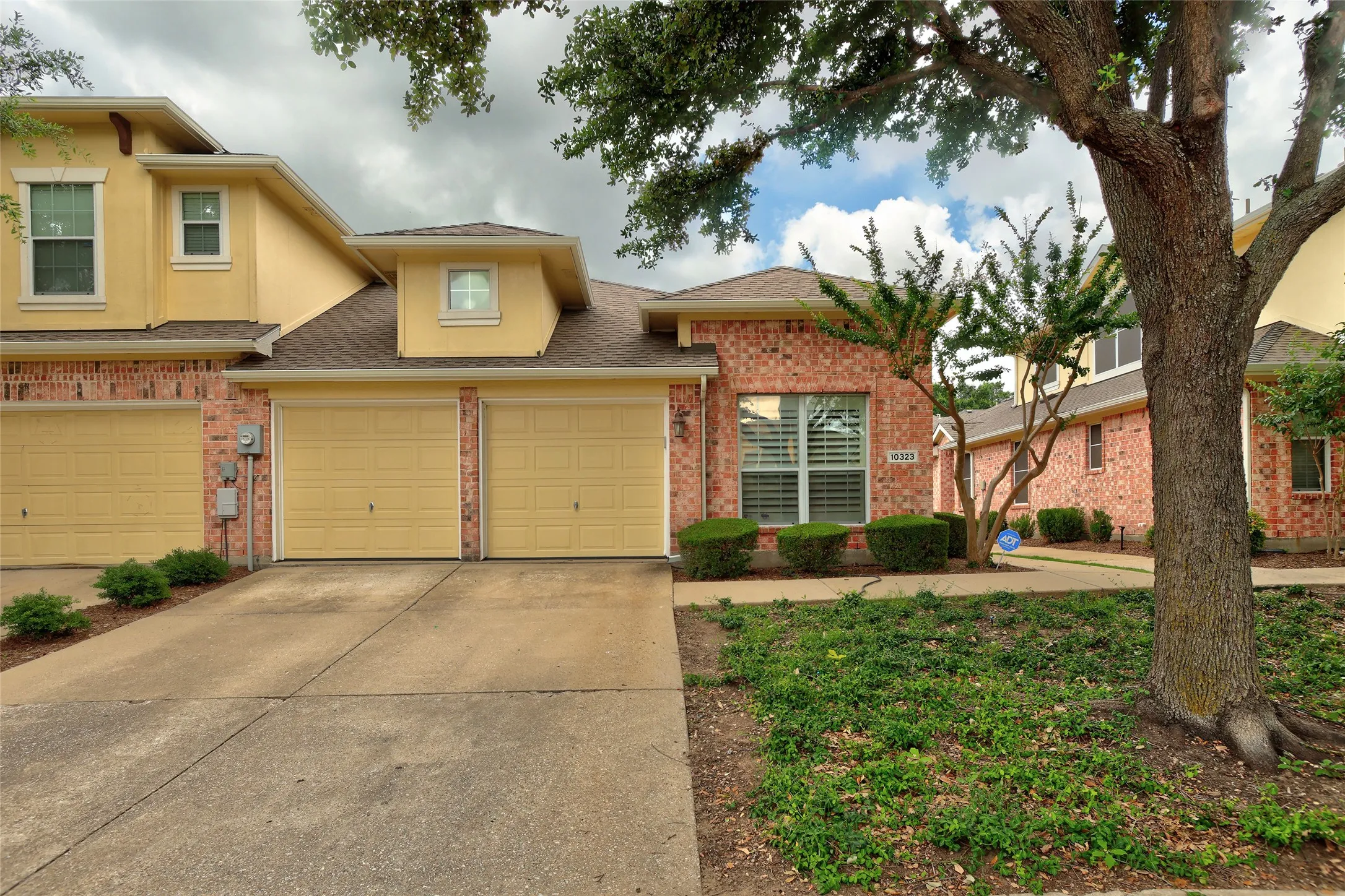 2 car garage with extended driveway space for additional parking