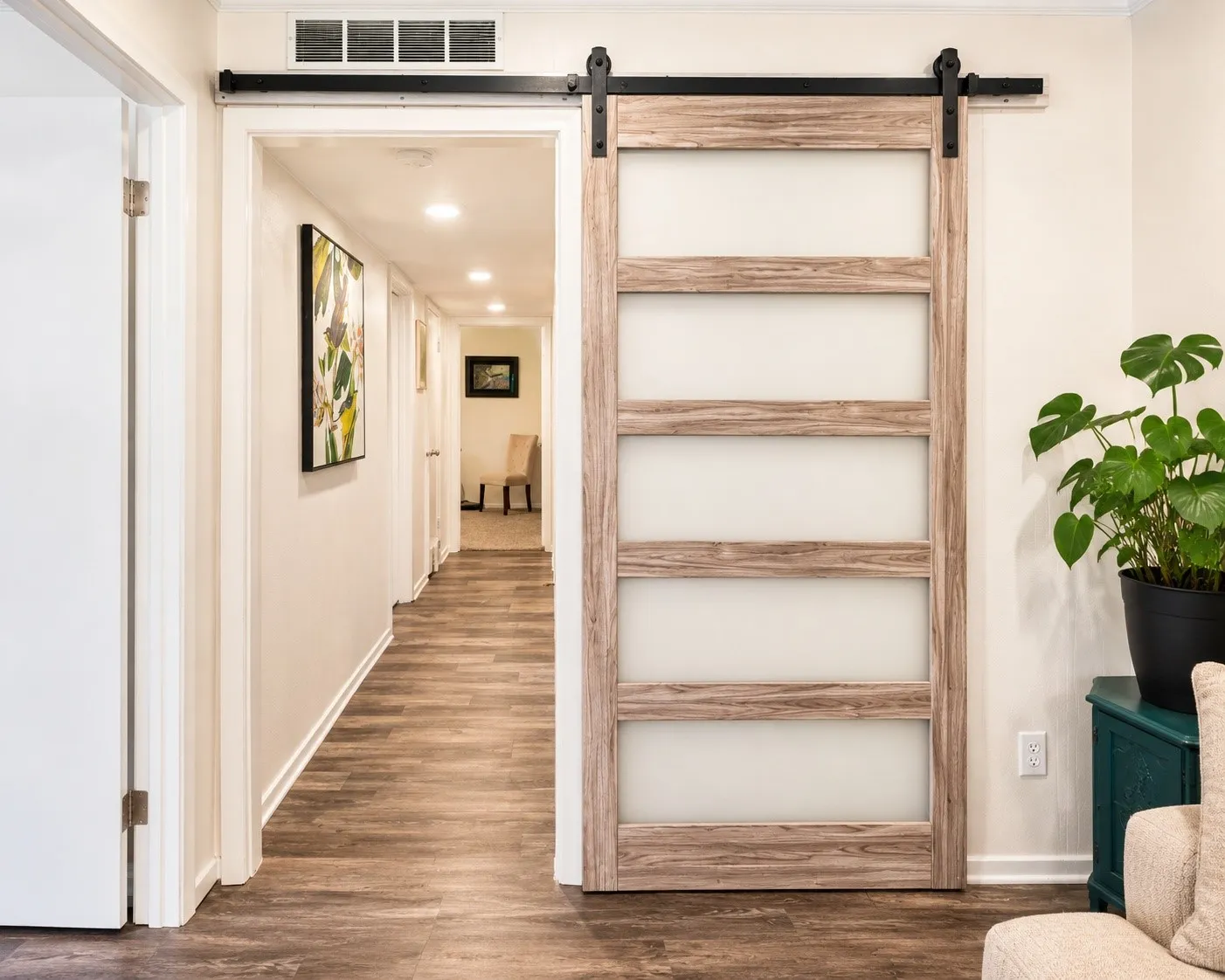 Hallway to all 3 bedrooms.