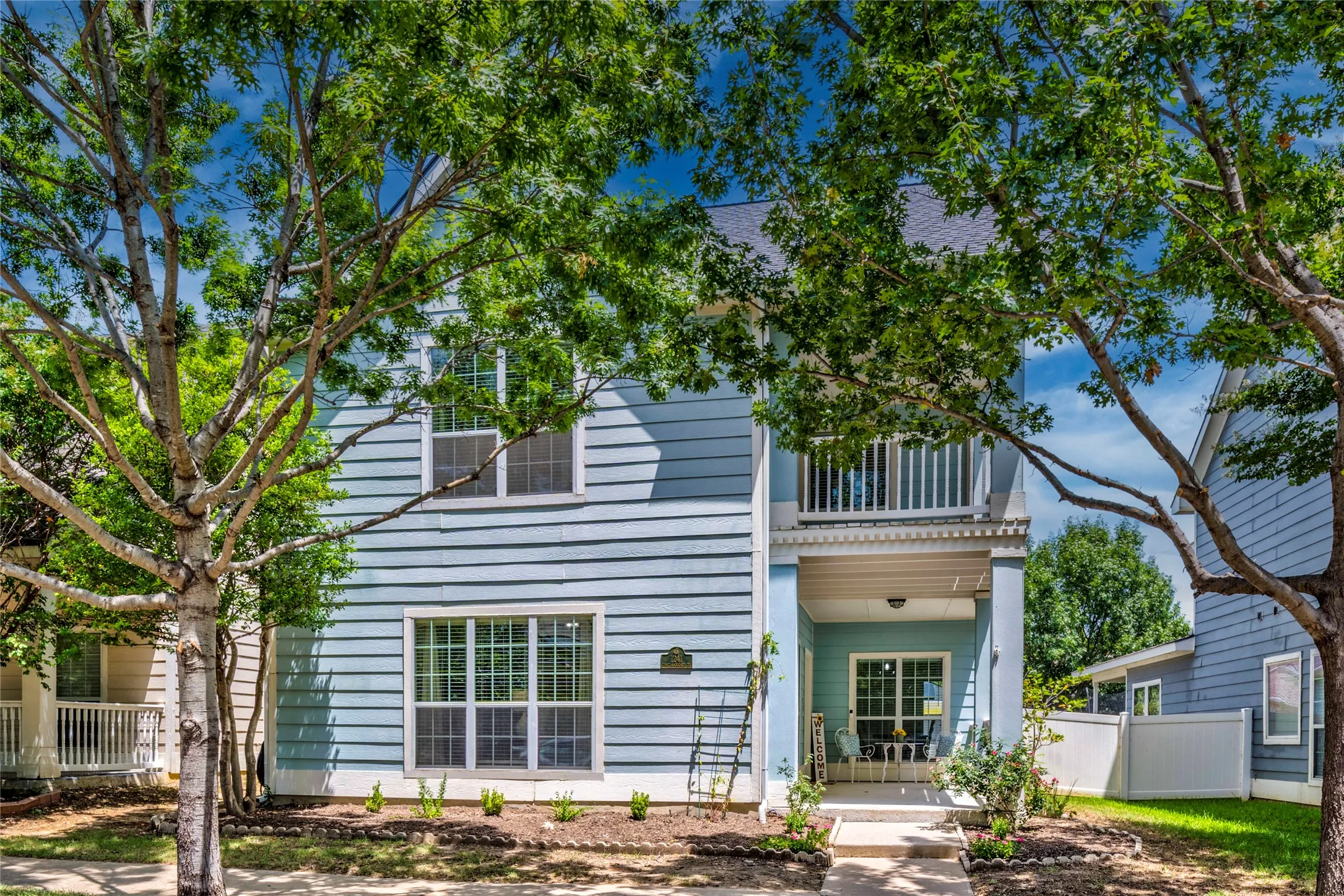 A lovely covered front porch enhances the curb appeal while providing the perfect spot to enjoy morning coffee, visit with neighbors, or unwind at the end of the day.
