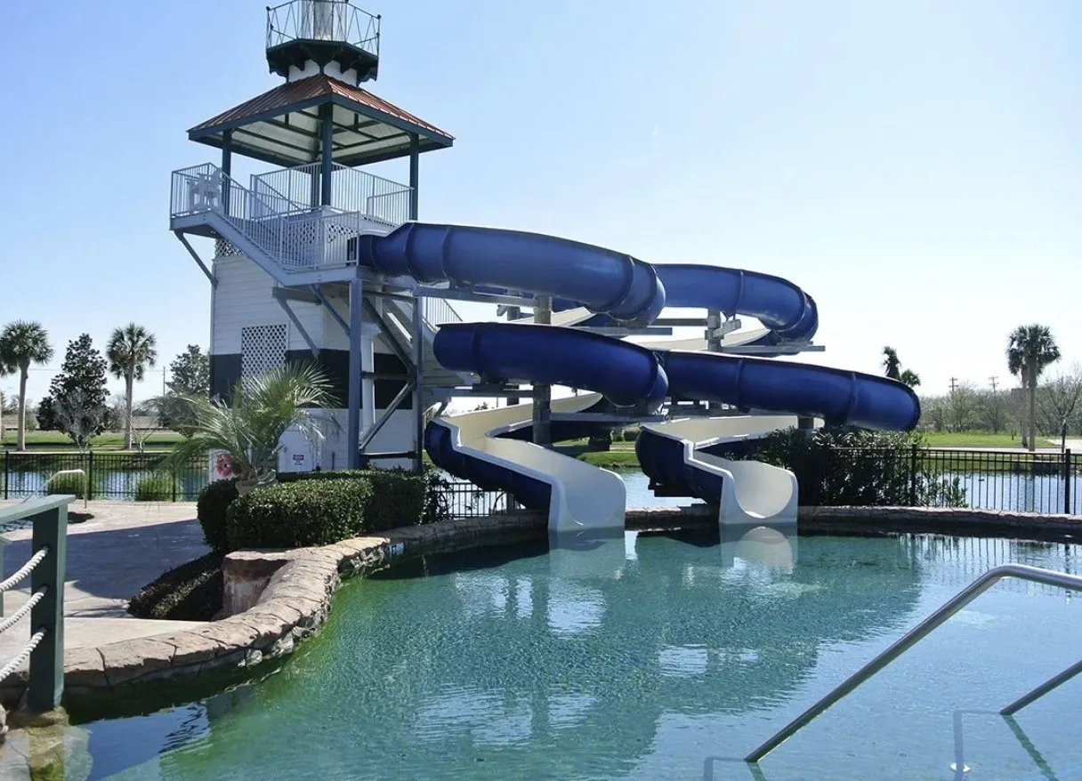 Savannah's own water park, designed for all ages, features 16’- and 25’-tall open-air slides that are 200’ long exit into a separate pool that cascades three feet to the main pool. A separate adult pool features a romantic waterfall, an 11’ deep end and water volleyball. An amazing rock grotto and a 15’-tall rock waterfall tumbling into the lake and pool add to the ambiance. The spray park, beach entry kids’ pool with tanning island, separate covered sand beach and bath house complete the features.