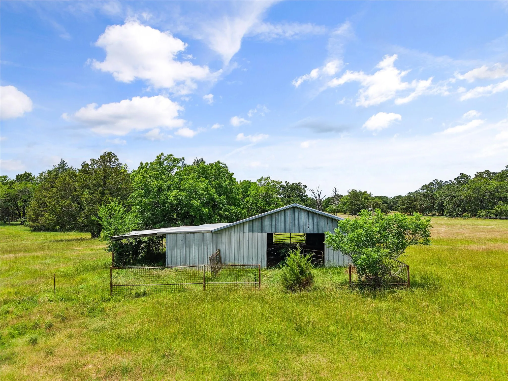 Pasture, barn, and open land offer excellent potential for livestock, horses, recreation, or country living.