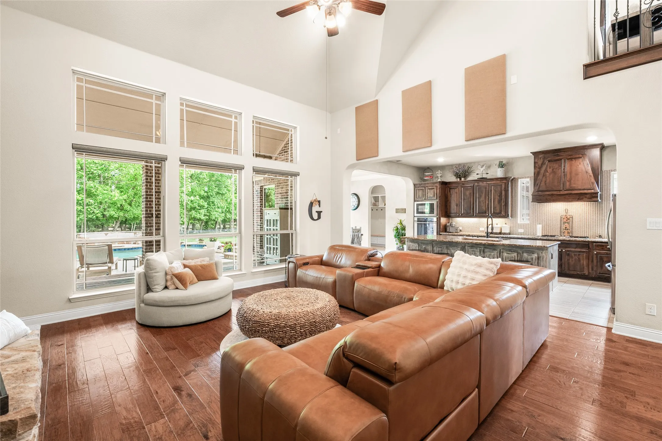 living area looks on to outdoor pool and treed lot