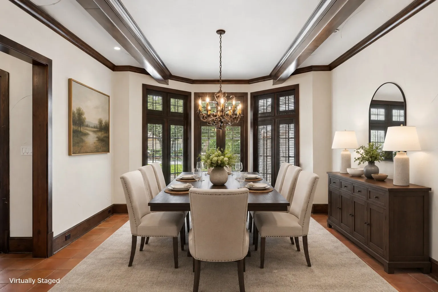 Formal dining room featuring a bay window with dark wood frames, contrasting light walls, and exposed ceiling beams