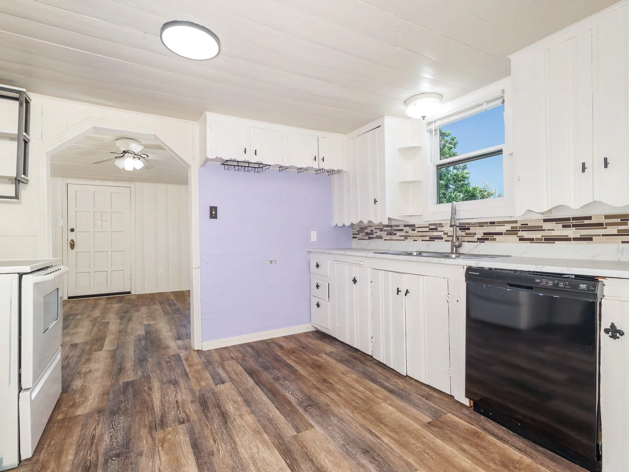 Great kitchen with dishwasher, stove, refrigerator will convey on request.