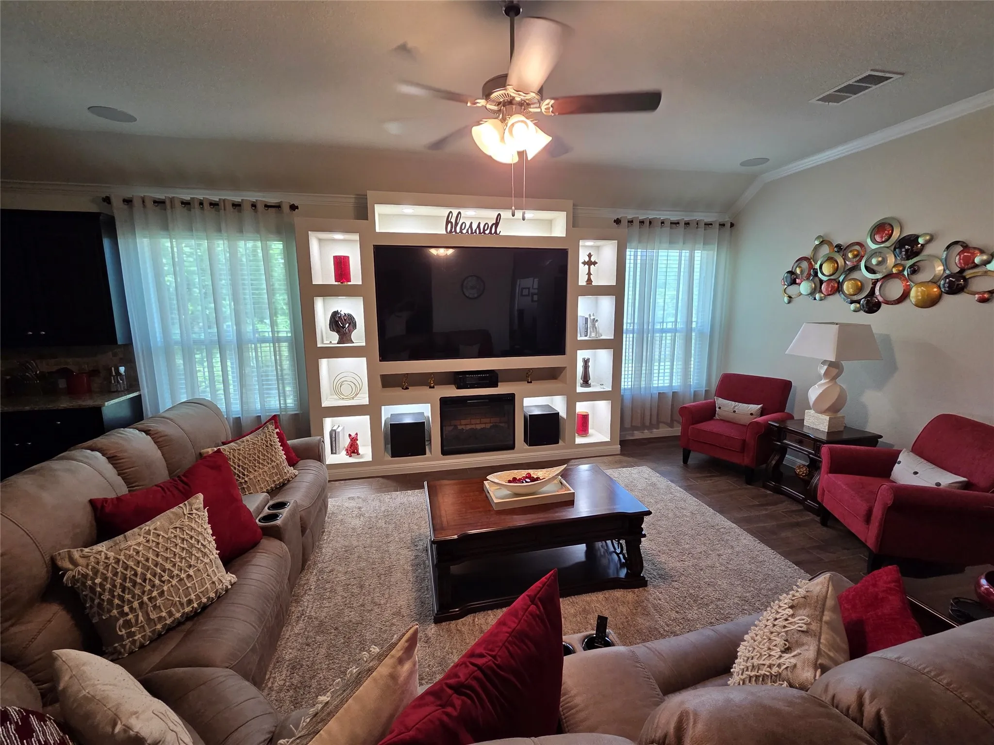 Living room with custom built entertainment center and crown molding