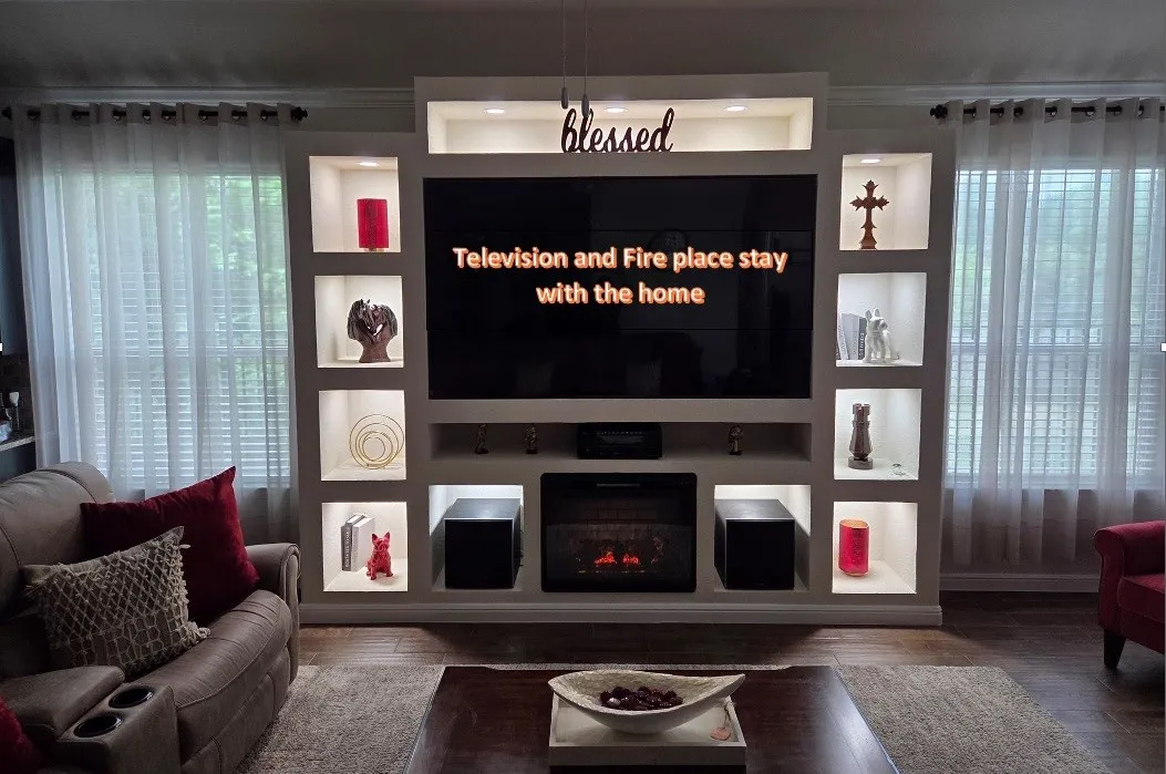 Custom built-in media center with integrated lighting and storage niches