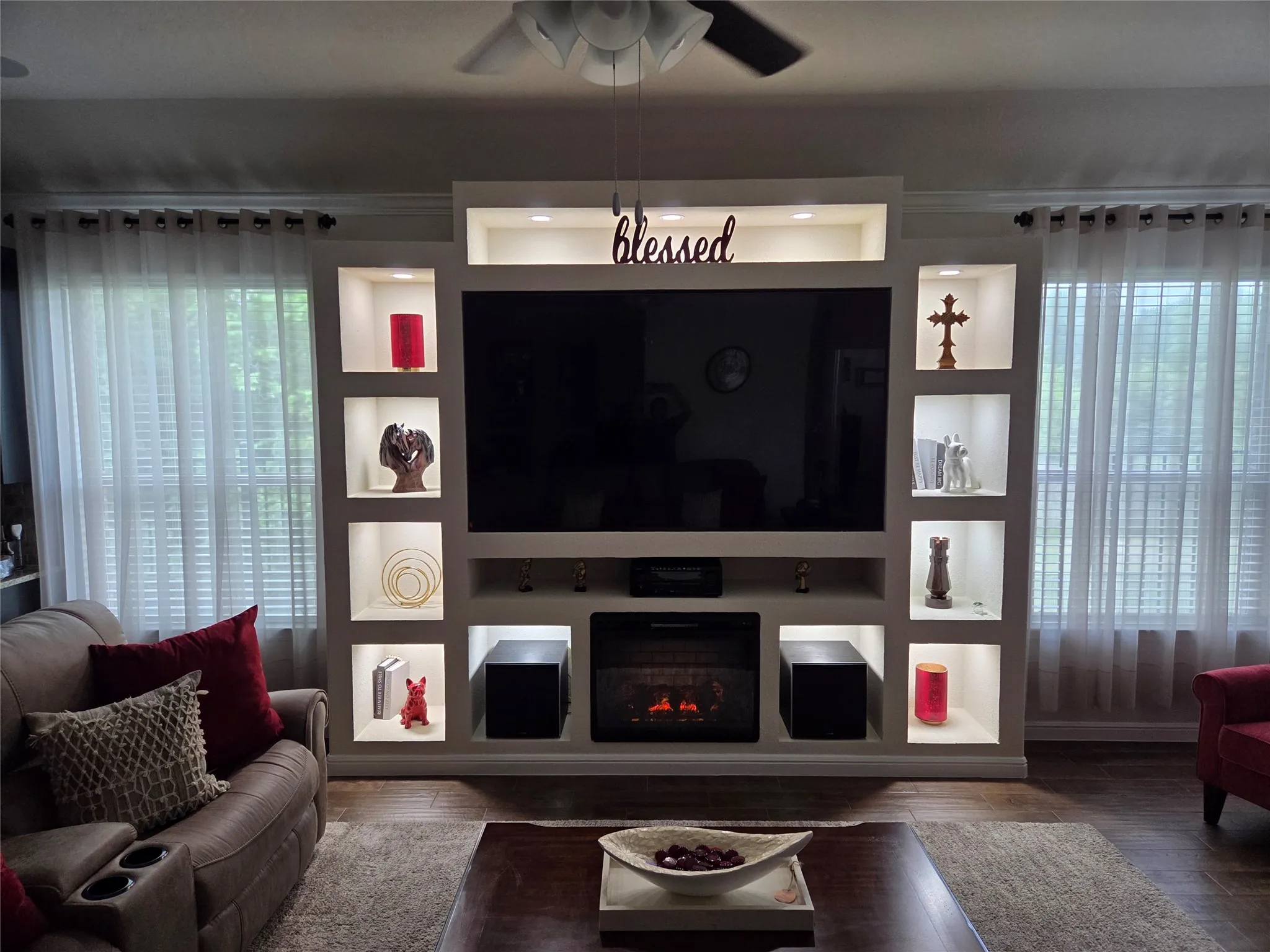 Custom built entertainment center. Large screen TV and  fire place stays