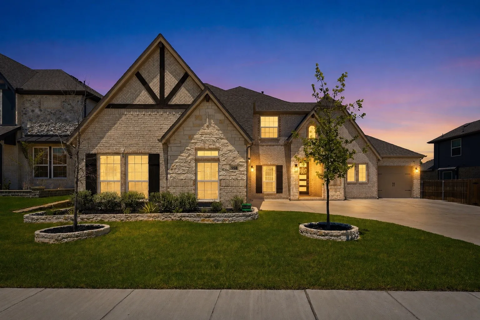 Stone facade residence featuring a prominent gabled roofline with timber accents