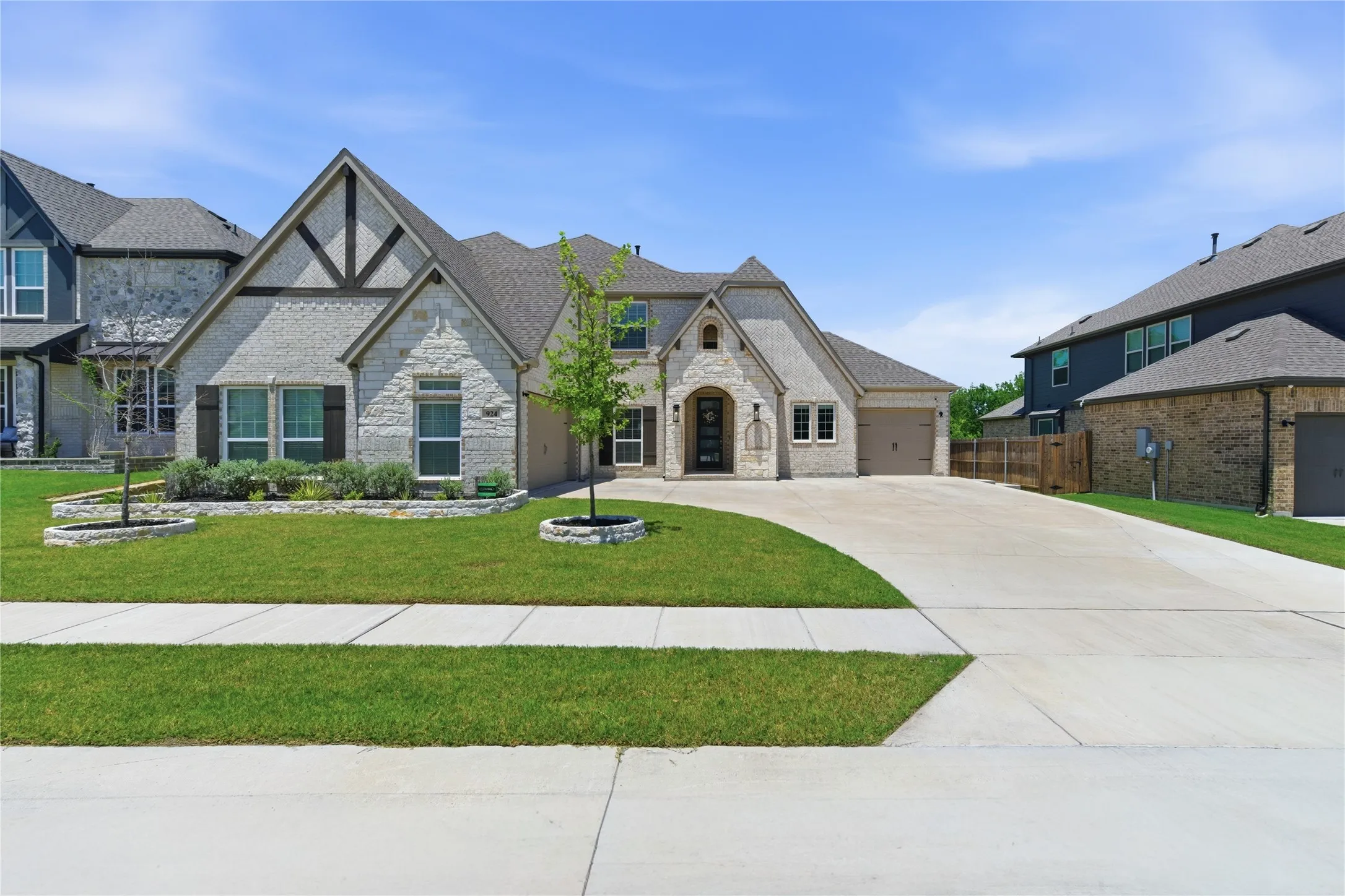 Stone and brick exterior with wood-tone accents