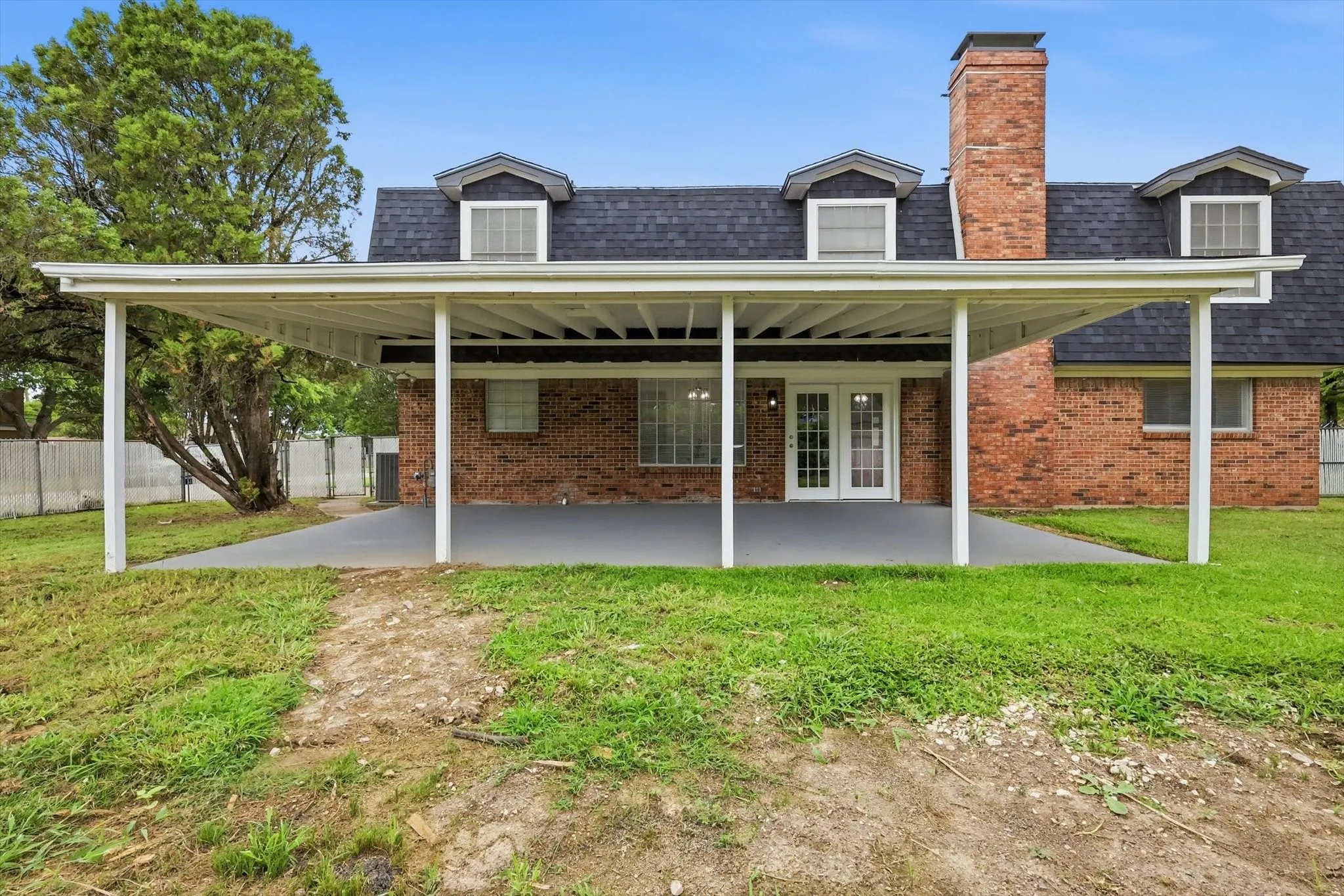 Expansive covered patio with a gray concrete surface