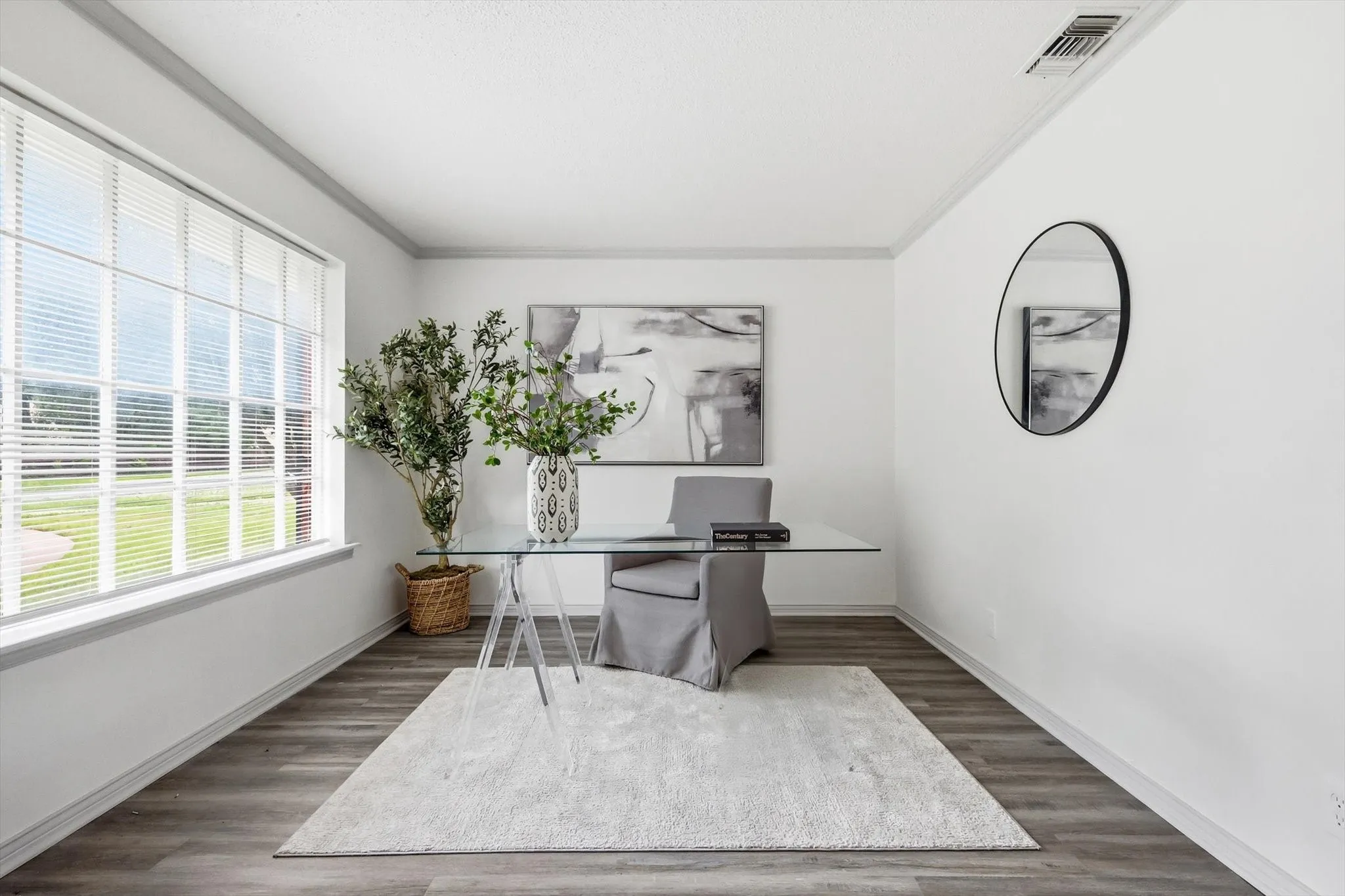 Expansive window featuring horizontal blinds and white trim