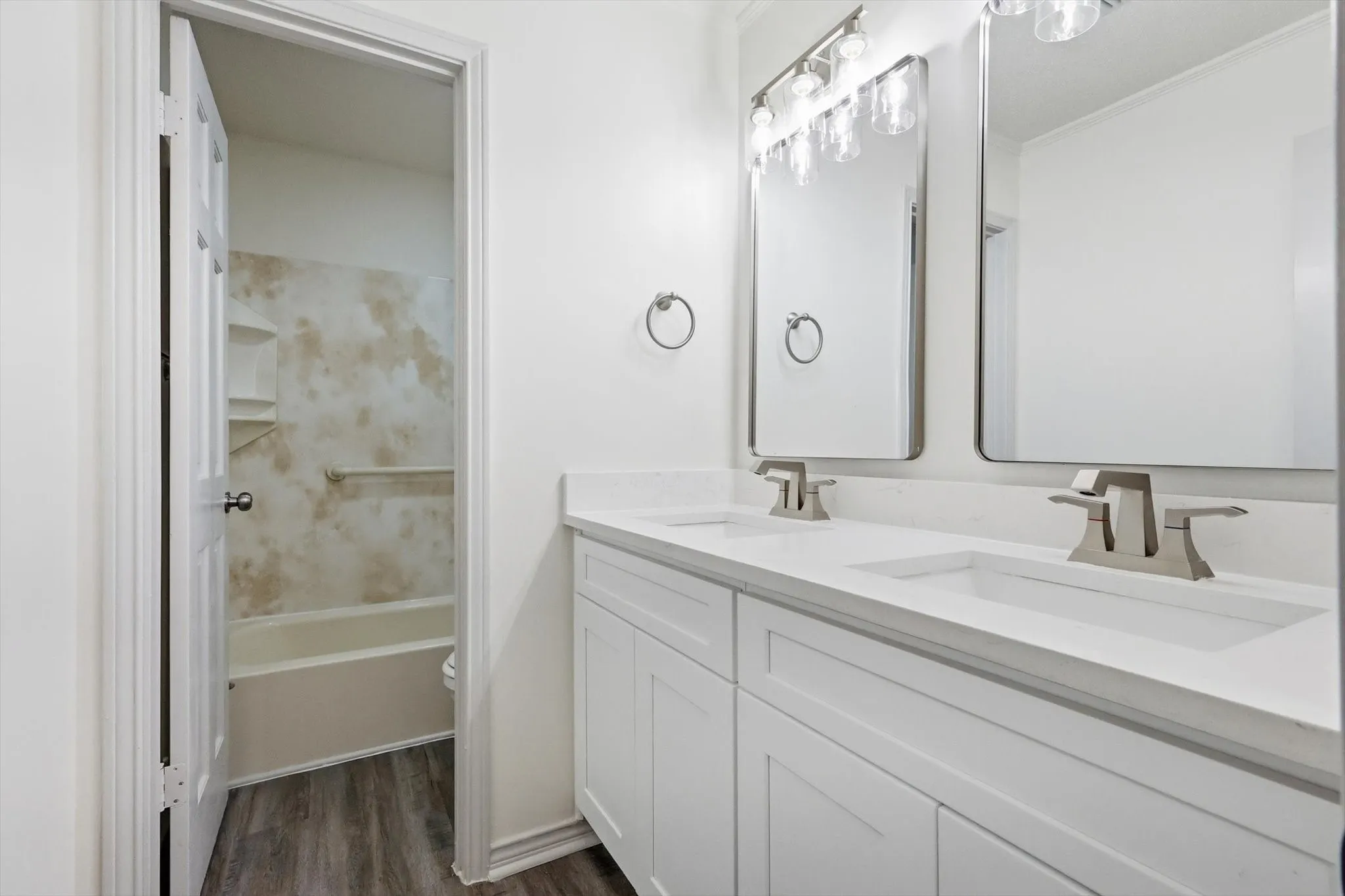 Double vanity with white cabinetry and integrated sinks