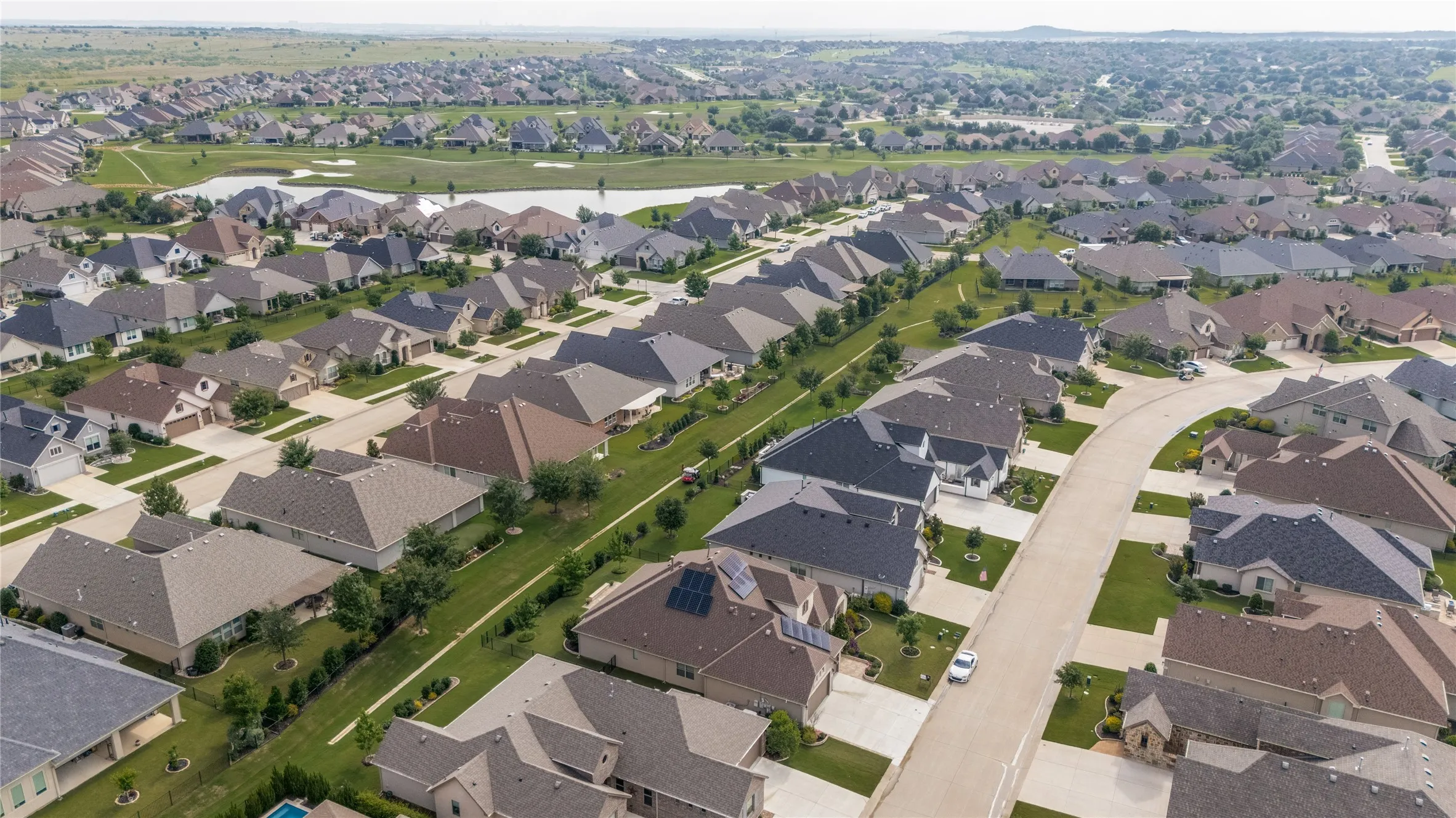 Home with the solar panels with golf course close by