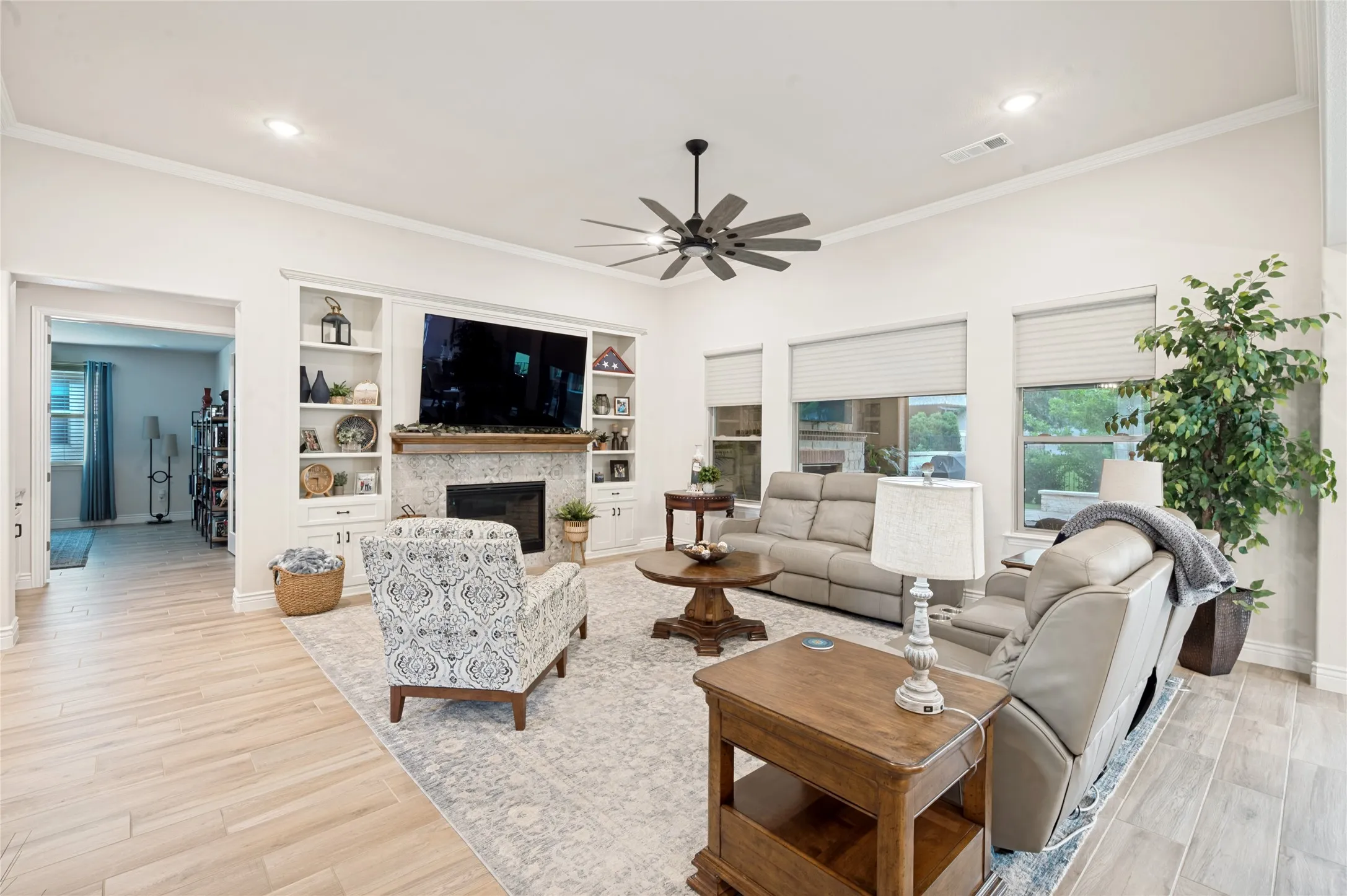 Gorgeous Built-ins flank the TV and Fireplace.