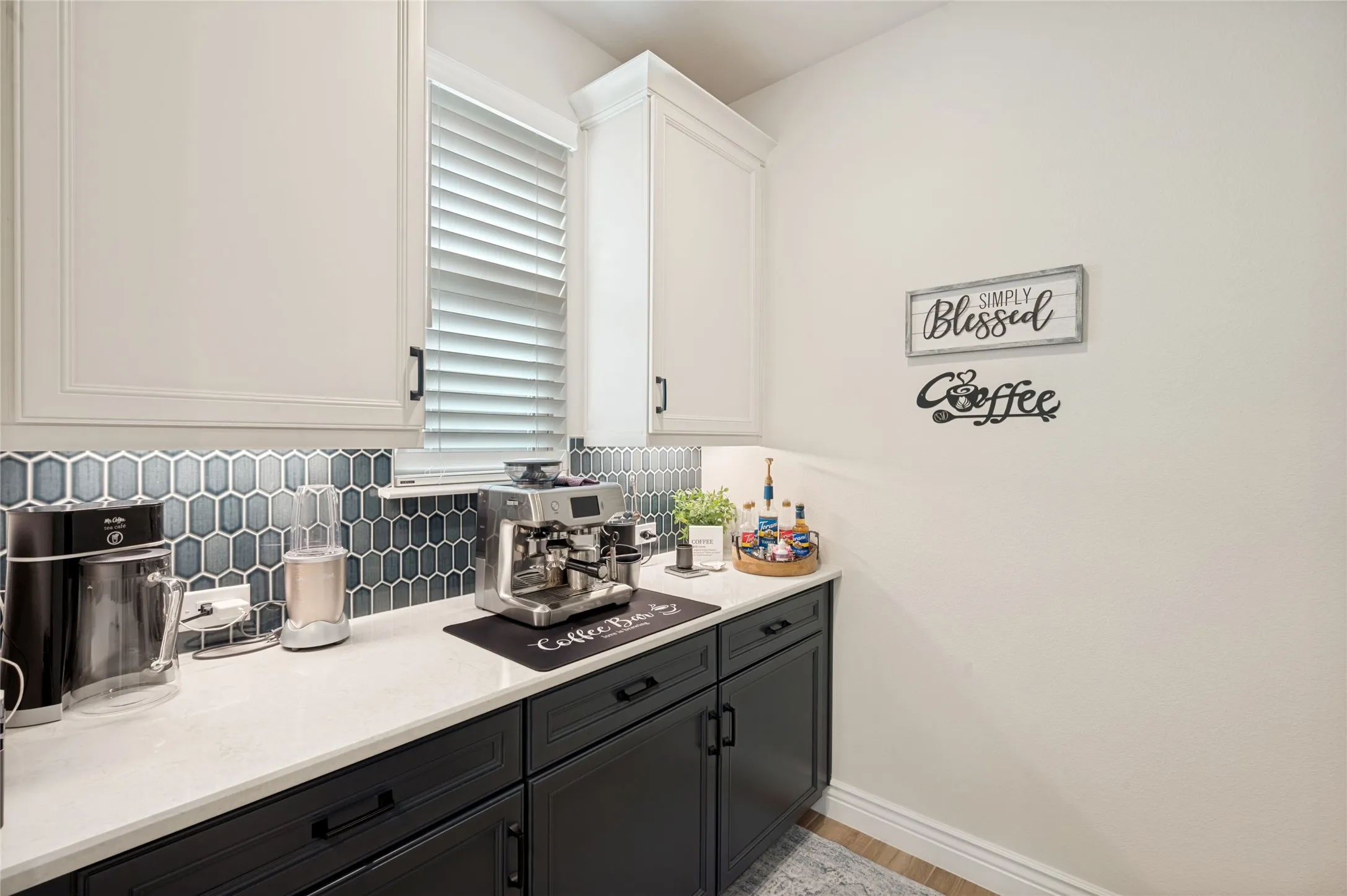 Adorable Coffee Bar set up in the Butler's Pantry. Walk in pantry is just opposite this.