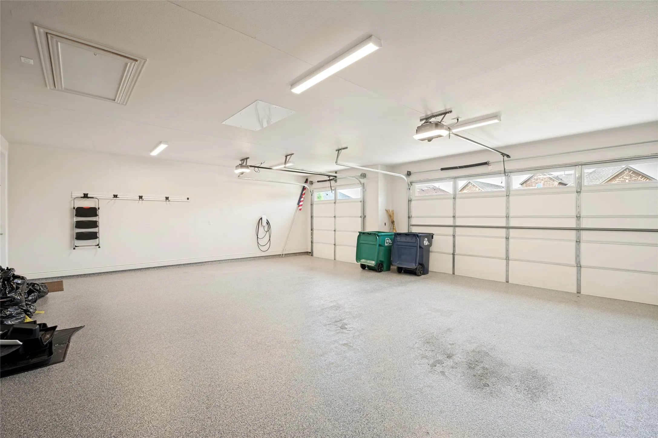 Epoxy Coated Garage Floor and Attic Lift-Telsa charger has been removed.