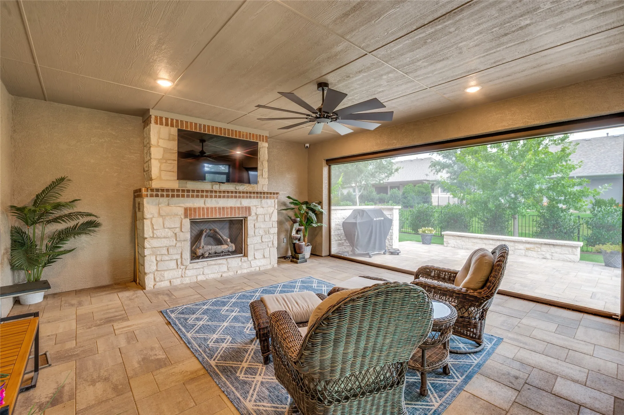 Pavered Covered Patio with fireplace and sunscreen