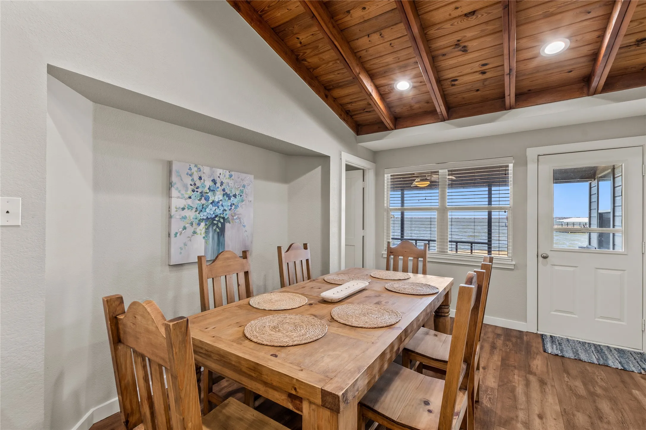 Dining room featuring wooden ceiling and wood finished floors