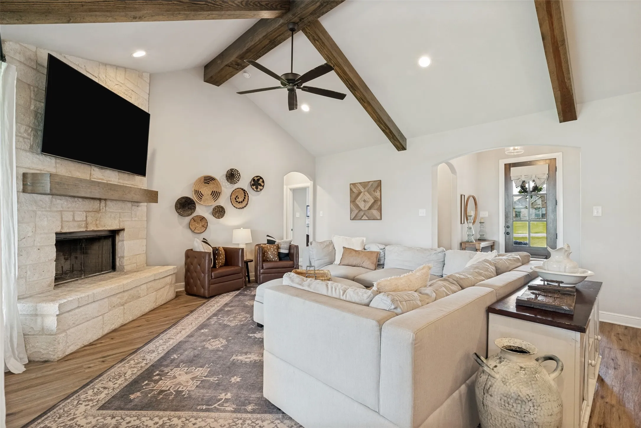 Spacious Living area, pretty front door to the right with powder bath and 4th bedroom/office