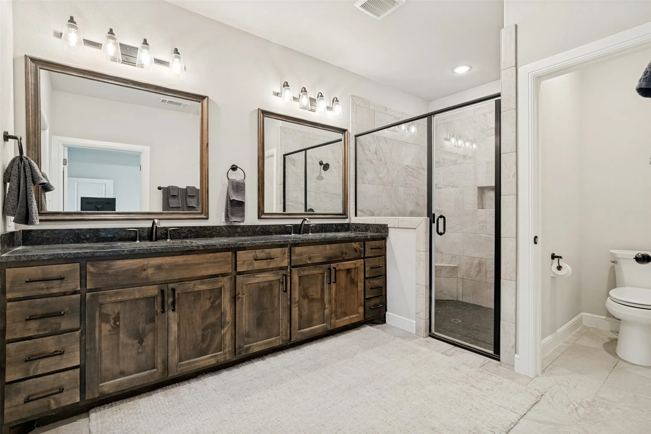 Primary Ensuite bath with shower and dual sinks