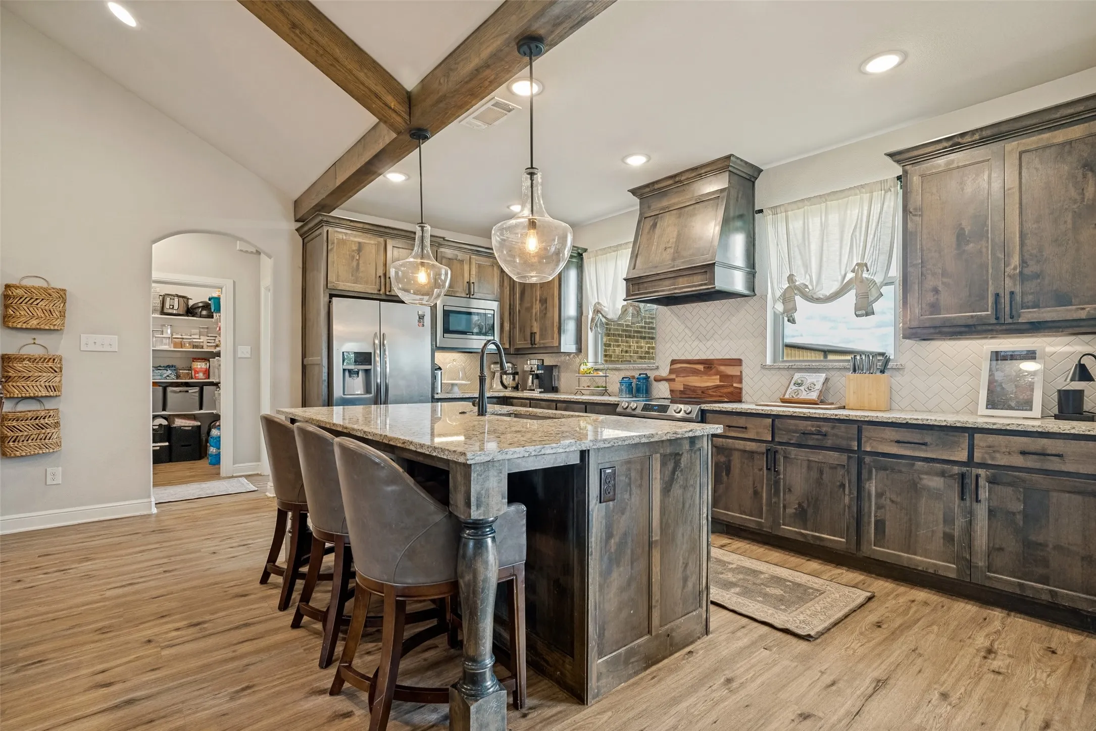 Open and functional galley kitchen is the heart of this home