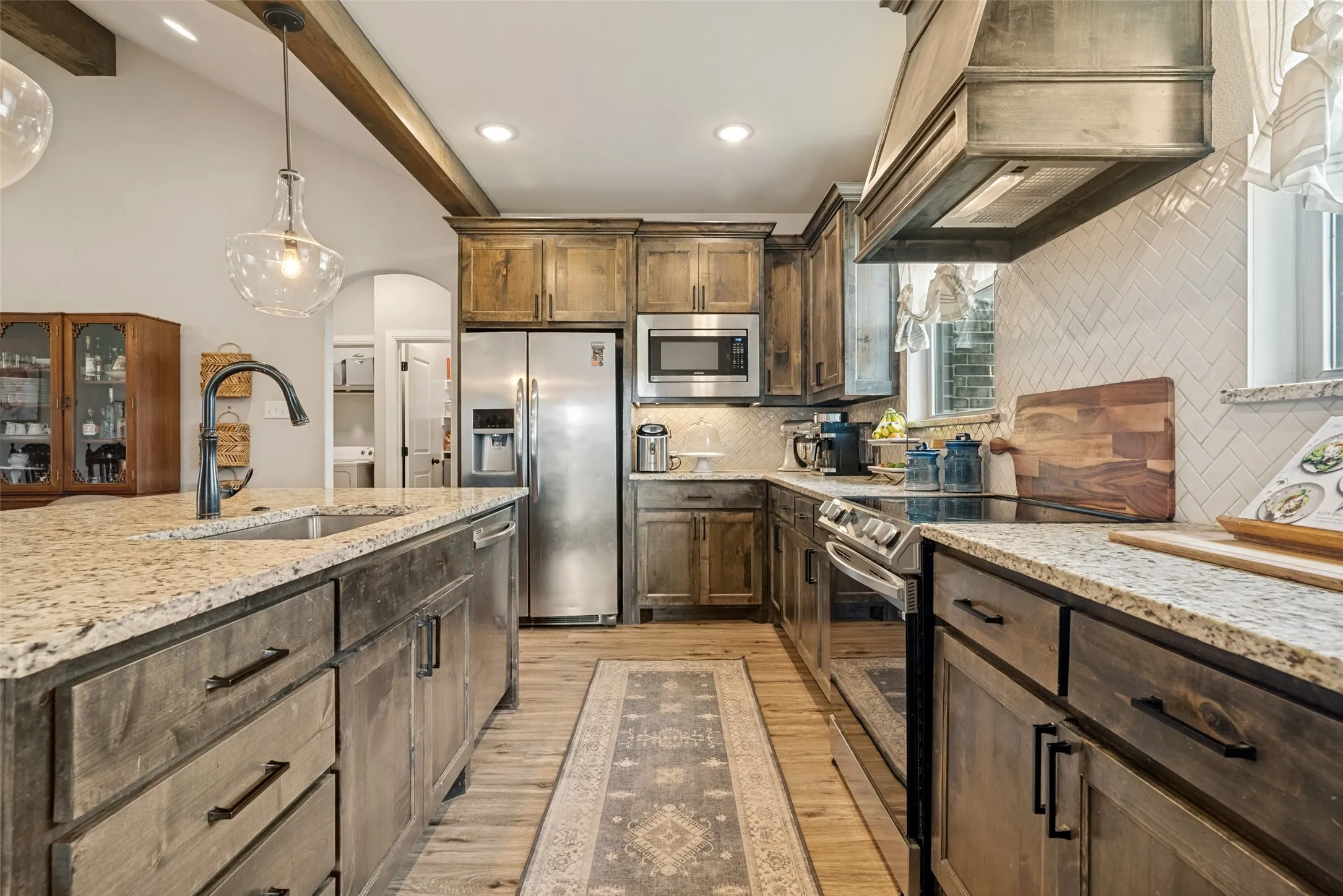Galley kitchen with tons of counter space and large island top