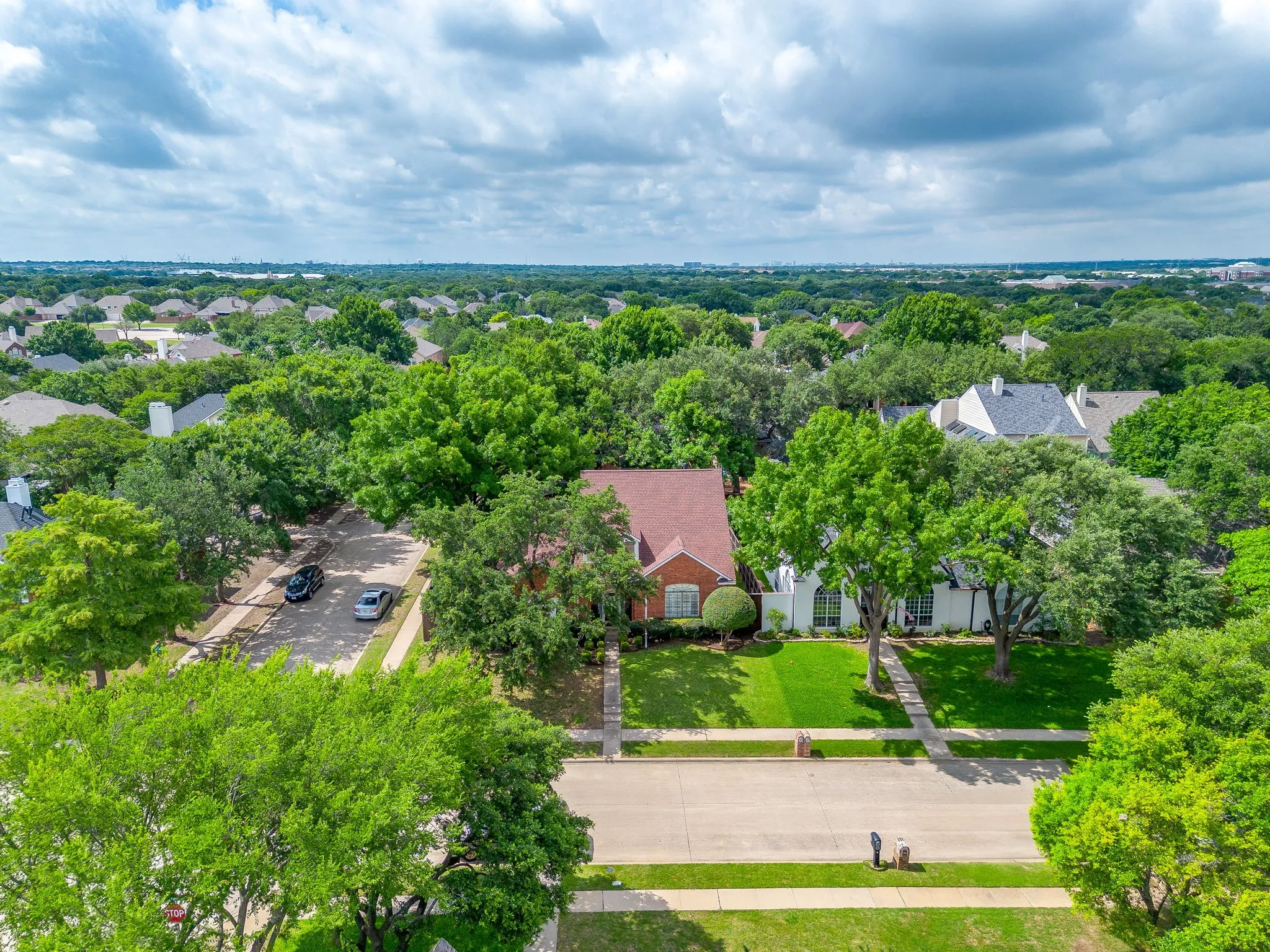 Residential property featuring a brick exterior on a corner lot