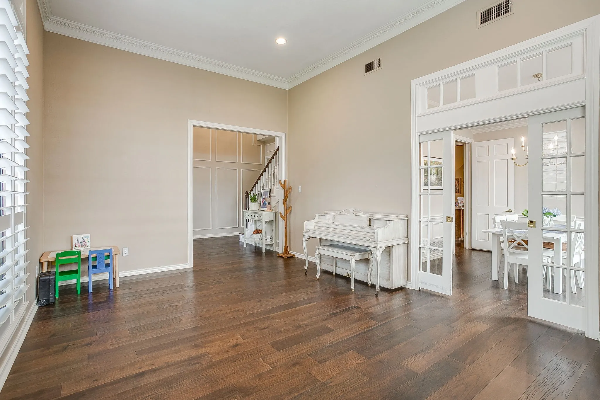 Formal living area or flex space leading into the formal dining room