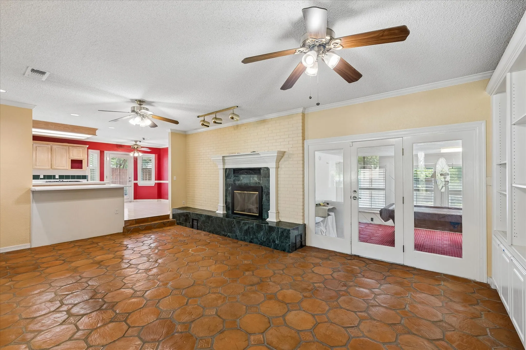 Terracotta-style hexagonal floor tiles extending throughout the main living area