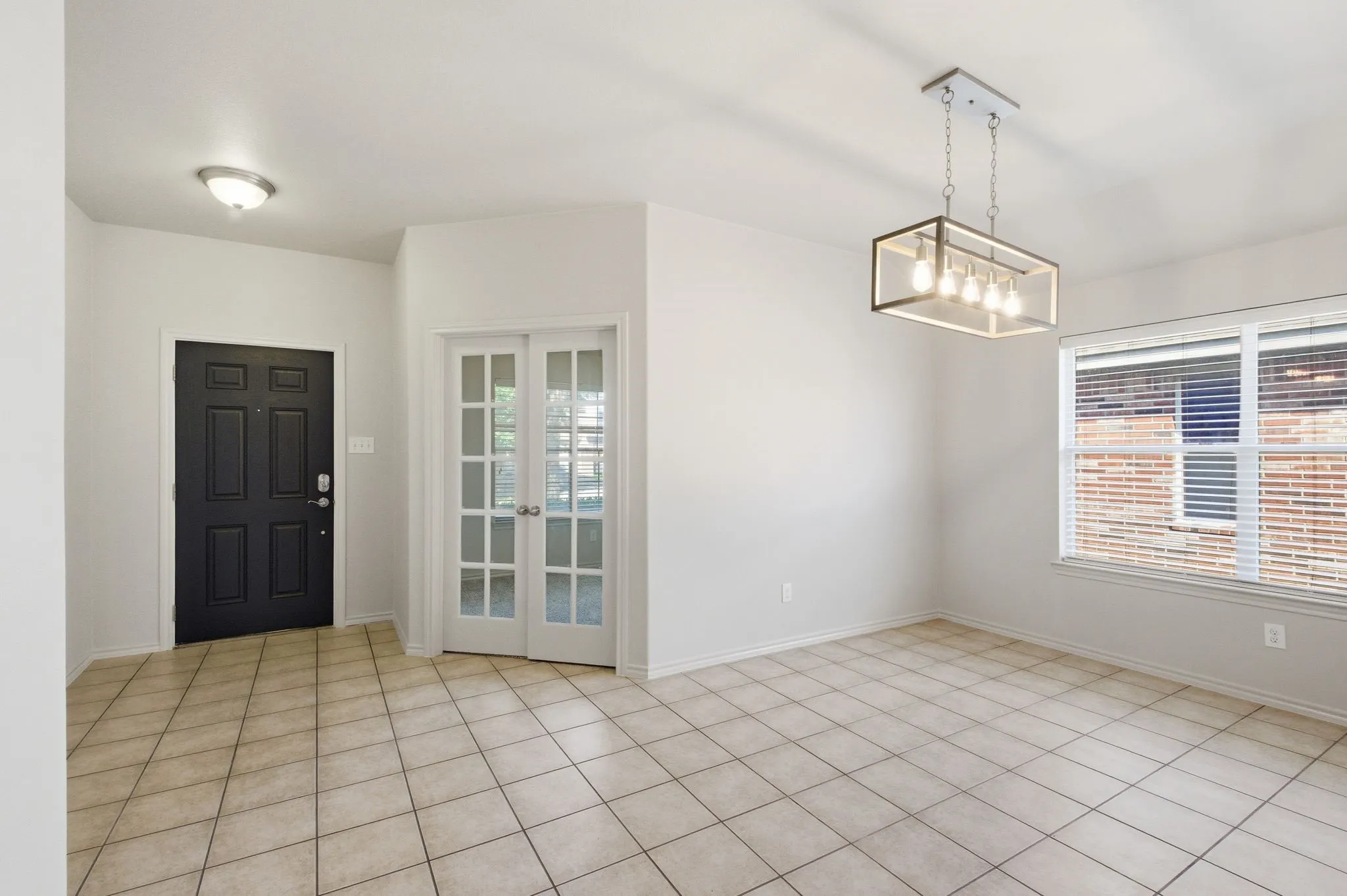 A view of the foyer, study and dining room