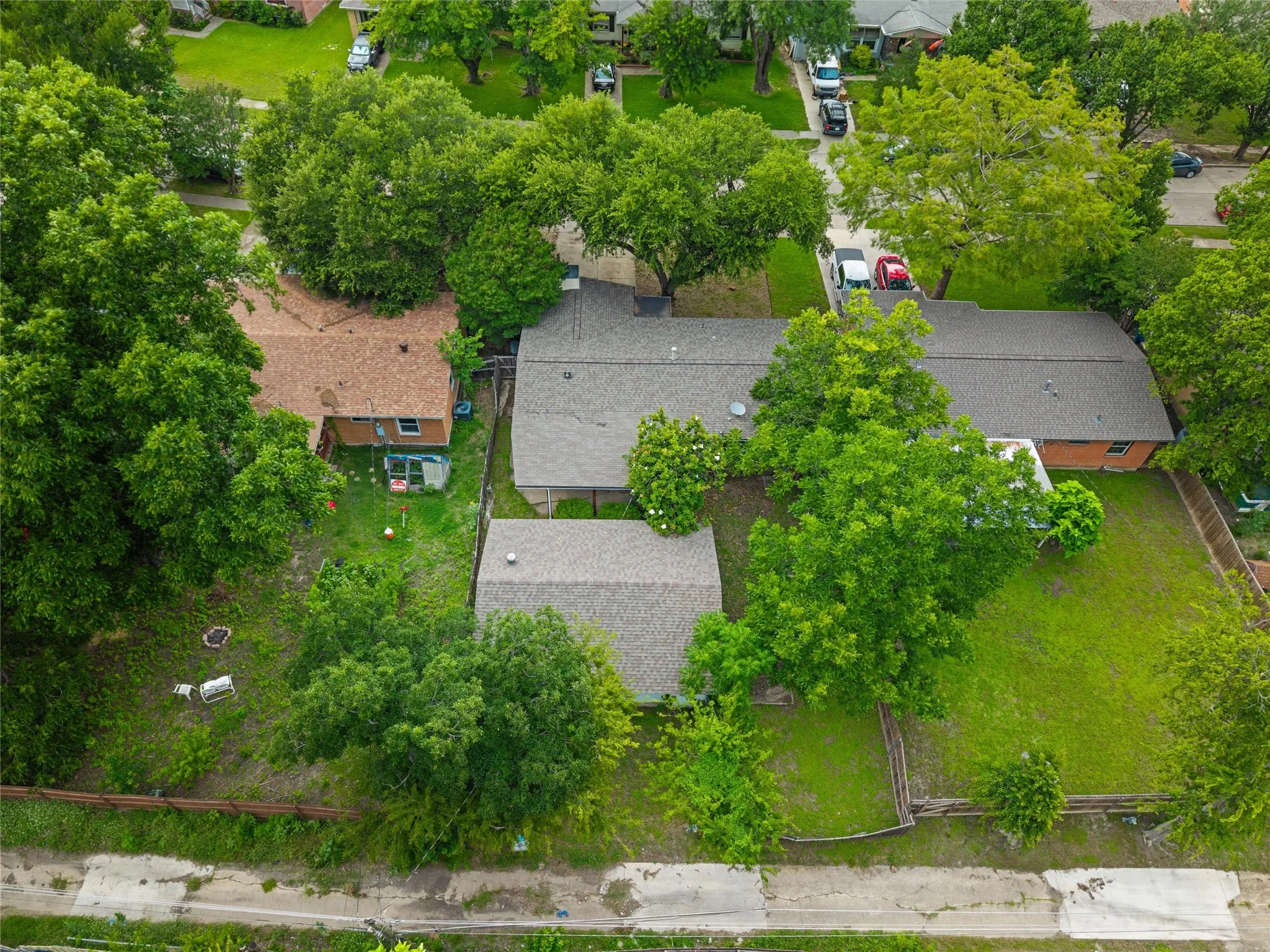Aerial view of the property and surrounding lot.