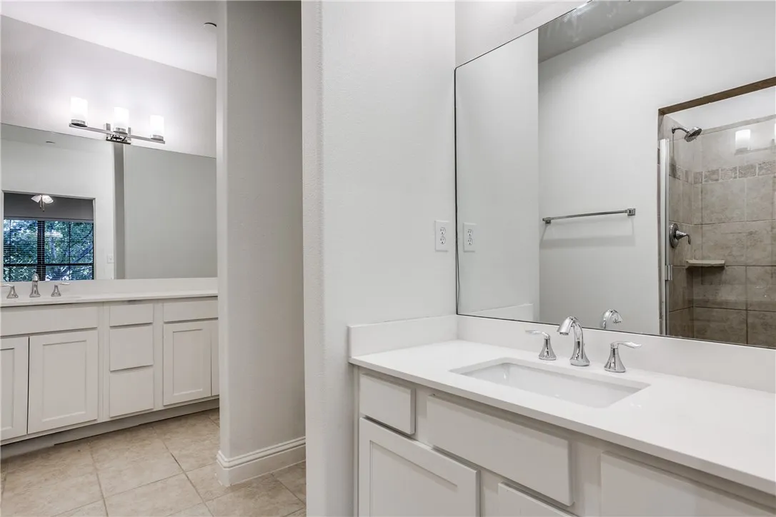 Spacious master bath features dual vanities and plenty of cabinet space in the newly updated vanities.