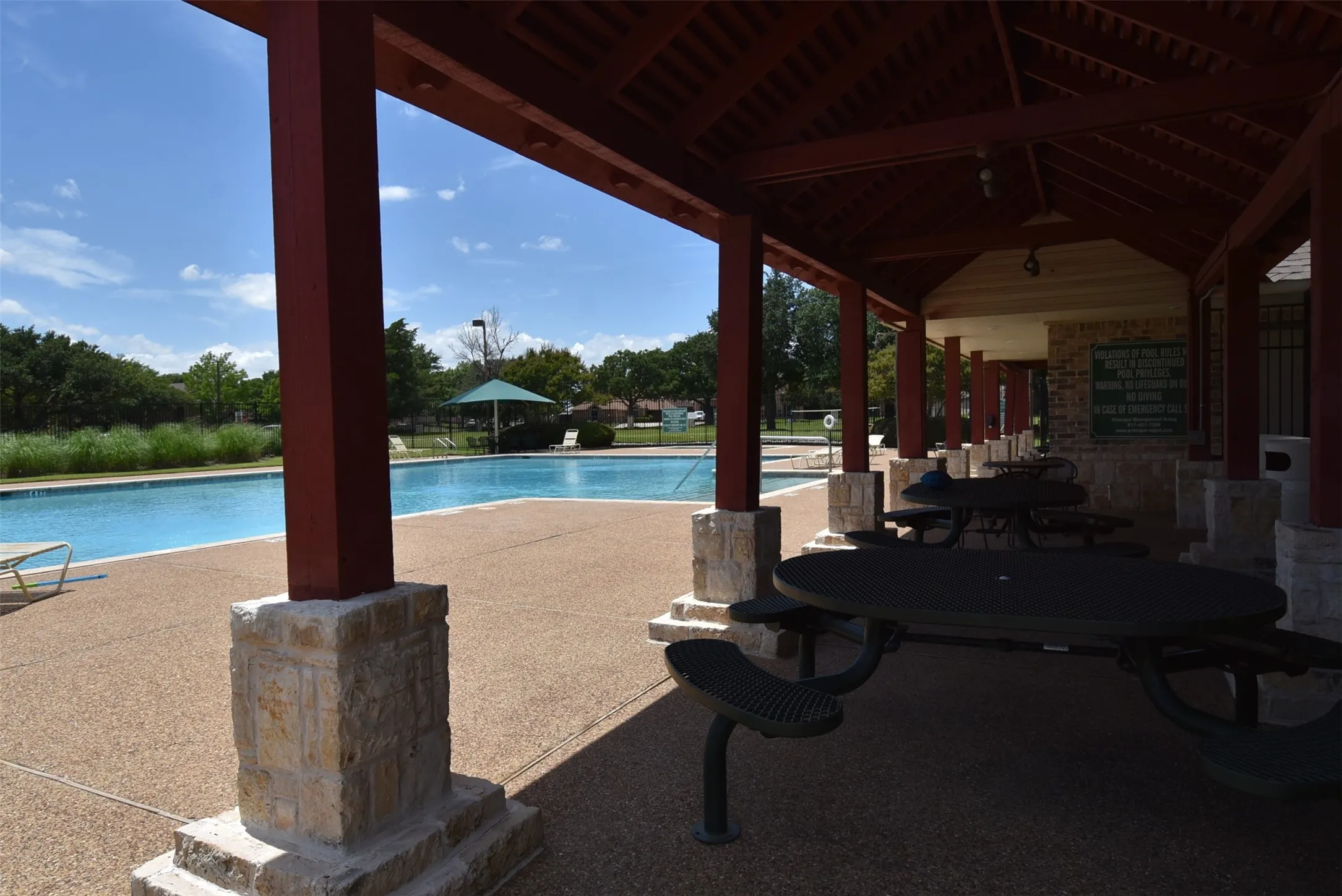 Covered patio with tables and chairs